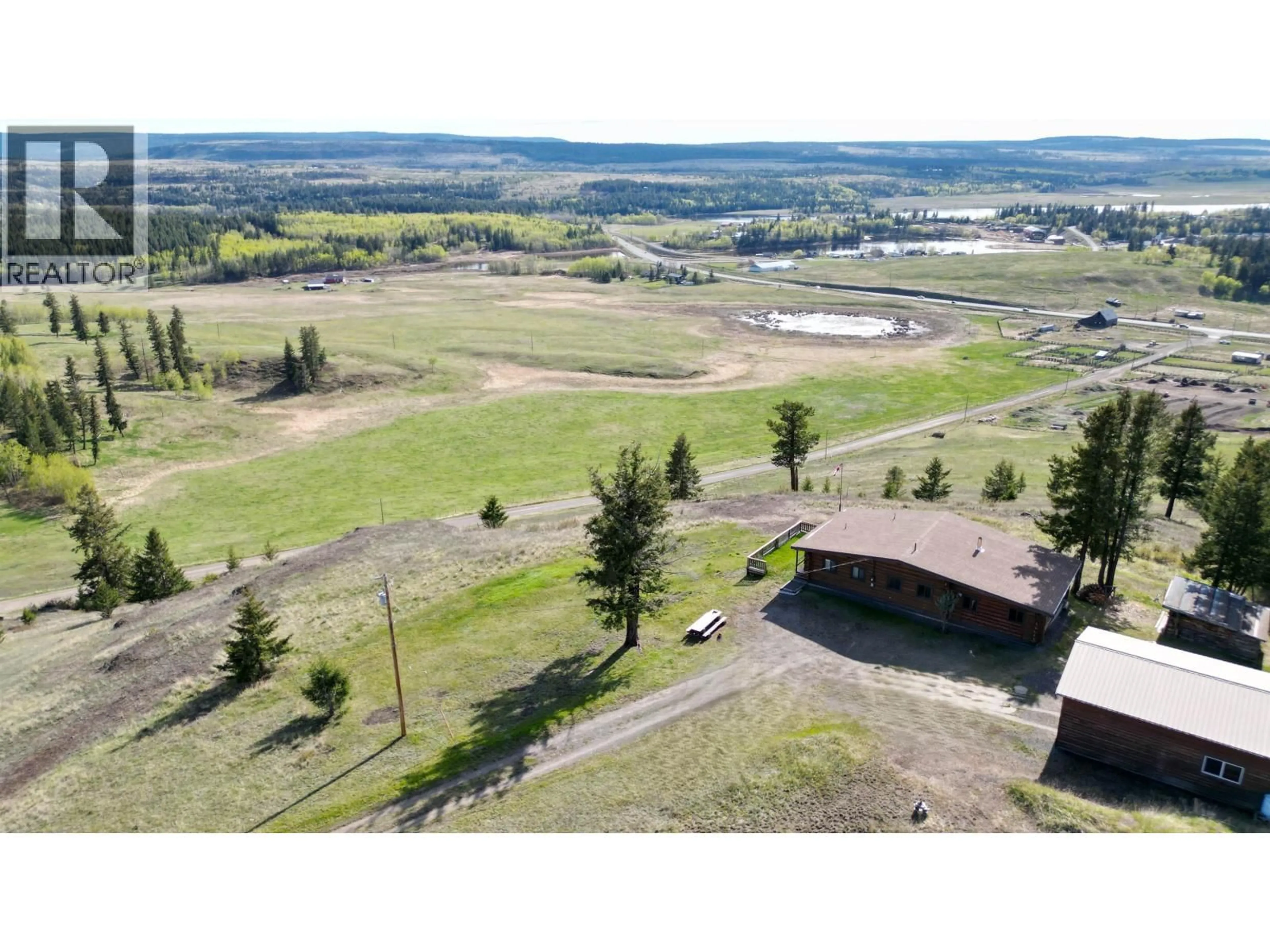 A pic from outside/outdoor area/front of a property/back of a property/a pic from drone, mountain view for 5549 BACKVALLEY ROAD, 100 Mile House British Columbia V0K2Z0