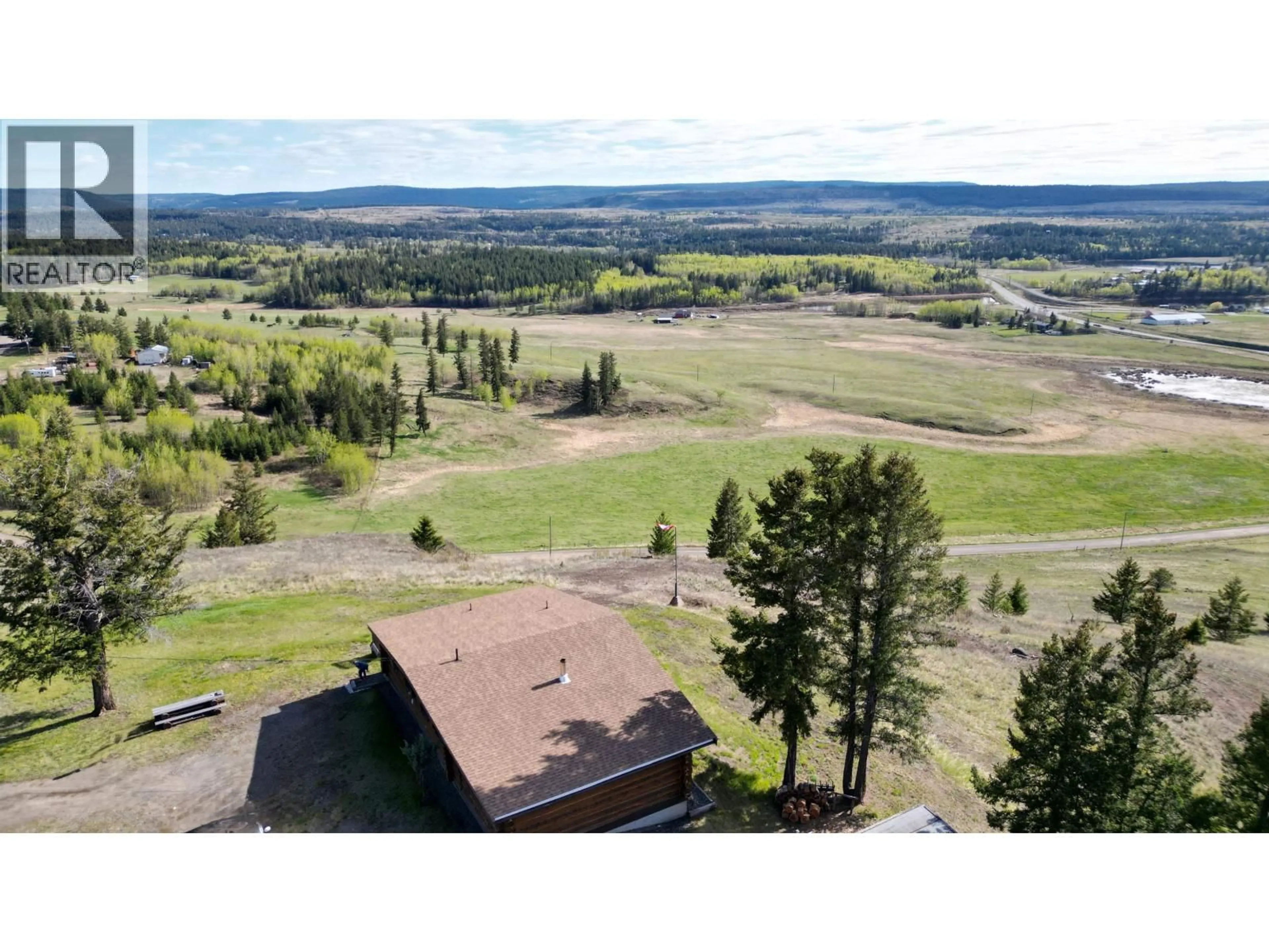 A pic from outside/outdoor area/front of a property/back of a property/a pic from drone, mountain view for 5549 BACKVALLEY ROAD, 100 Mile House British Columbia V0K2Z0