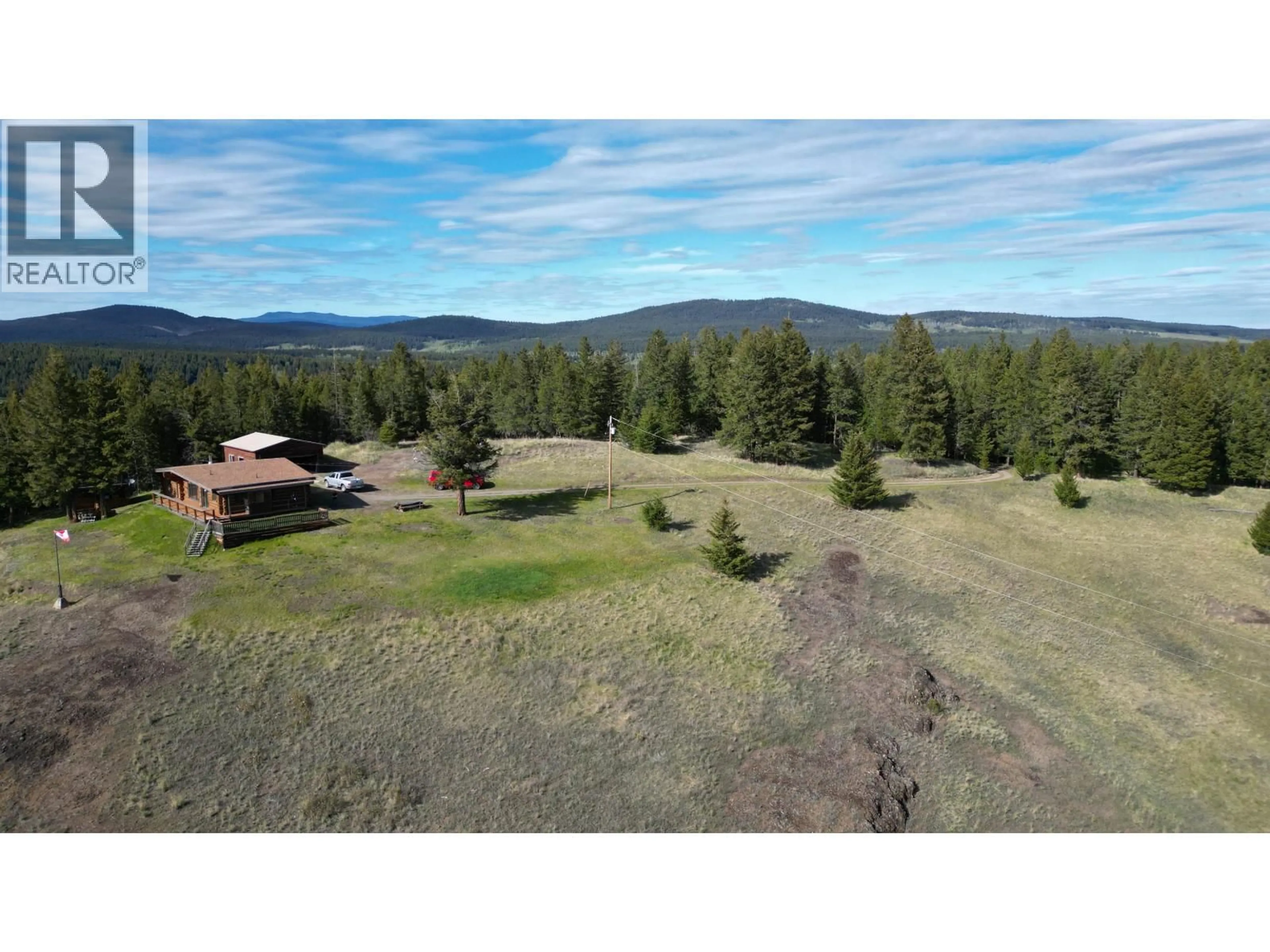 A pic from outside/outdoor area/front of a property/back of a property/a pic from drone, forest/trees view for 5549 BACKVALLEY ROAD, 100 Mile House British Columbia V0K2Z0