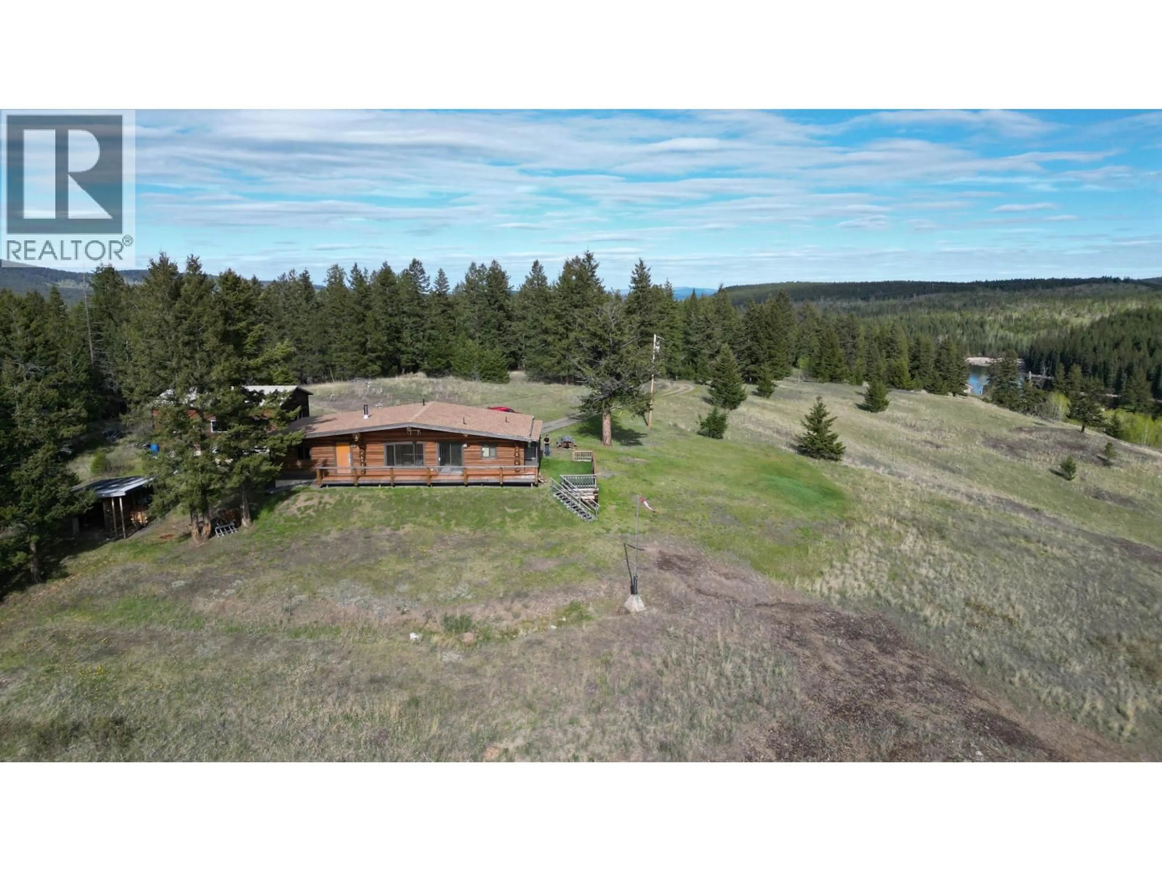 A pic from outside/outdoor area/front of a property/back of a property/a pic from drone, unknown for 5549 BACKVALLEY ROAD, 100 Mile House British Columbia V0K2Z0