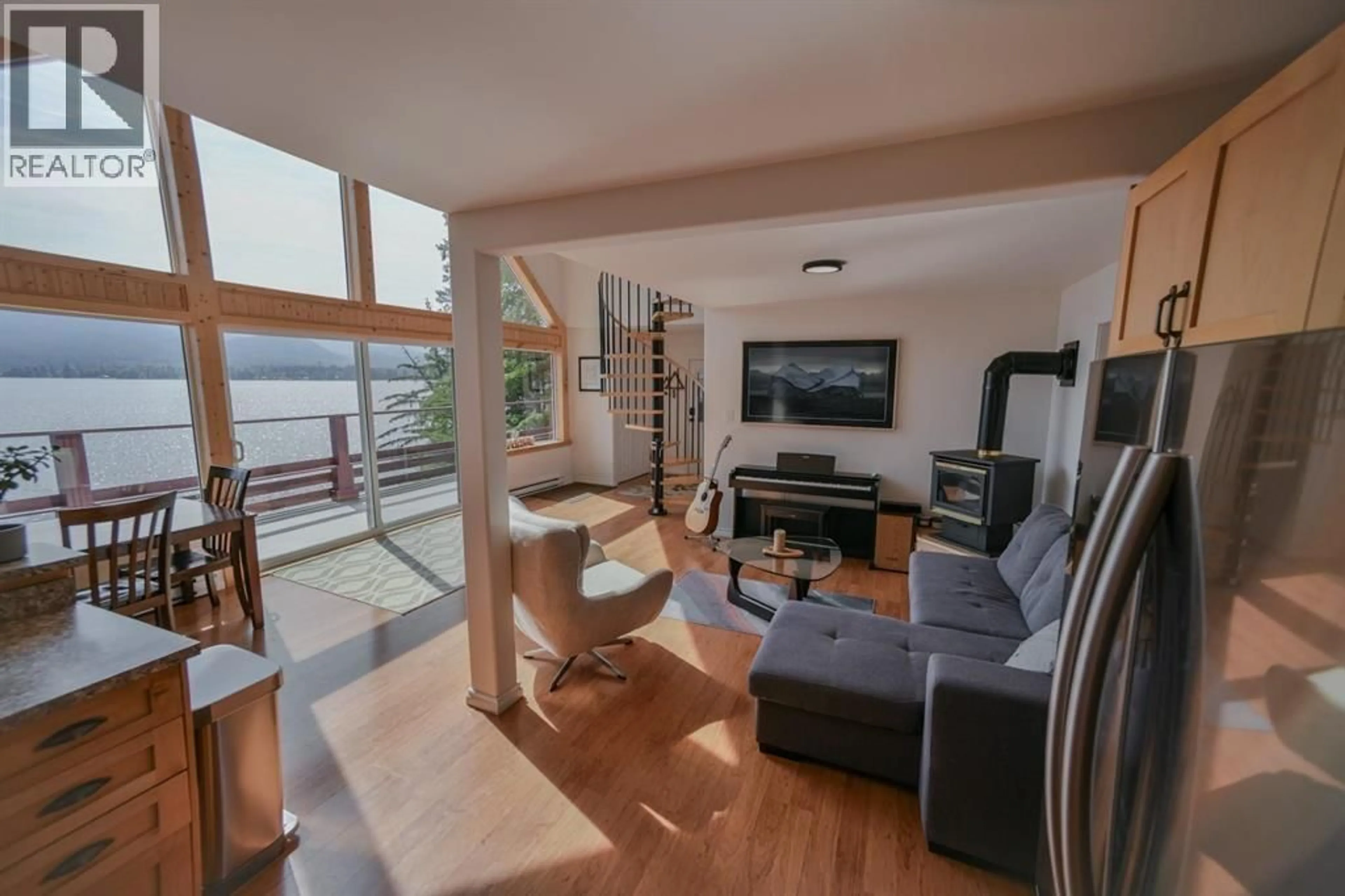 Living room with furniture, wood/laminate floor for 2364 CATT POINT ROAD, Terrace British Columbia V8G4V1