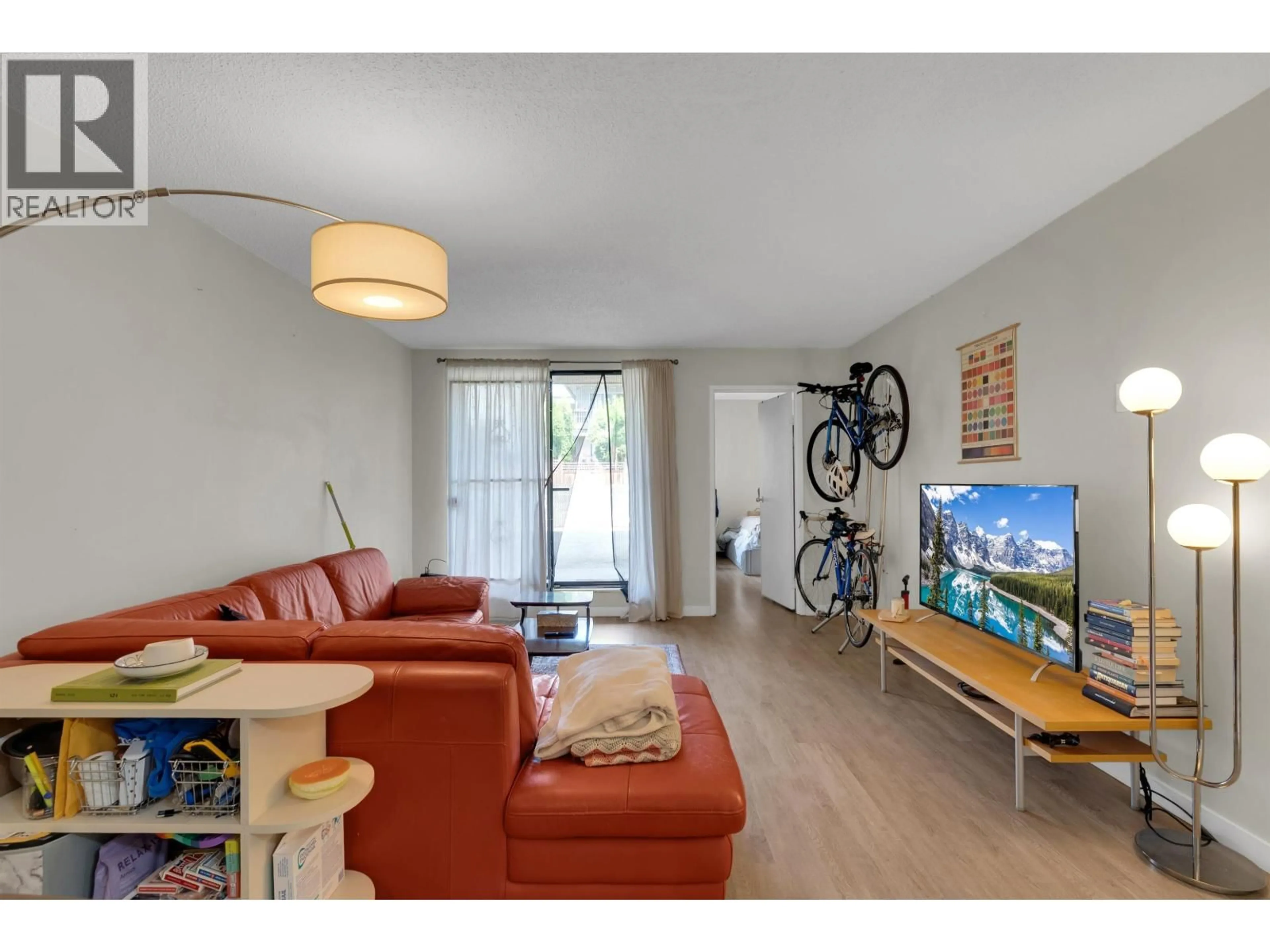 Living room with furniture, wood/laminate floor for 105 - 975 BROADWAY, Vancouver British Columbia V5T1Y3