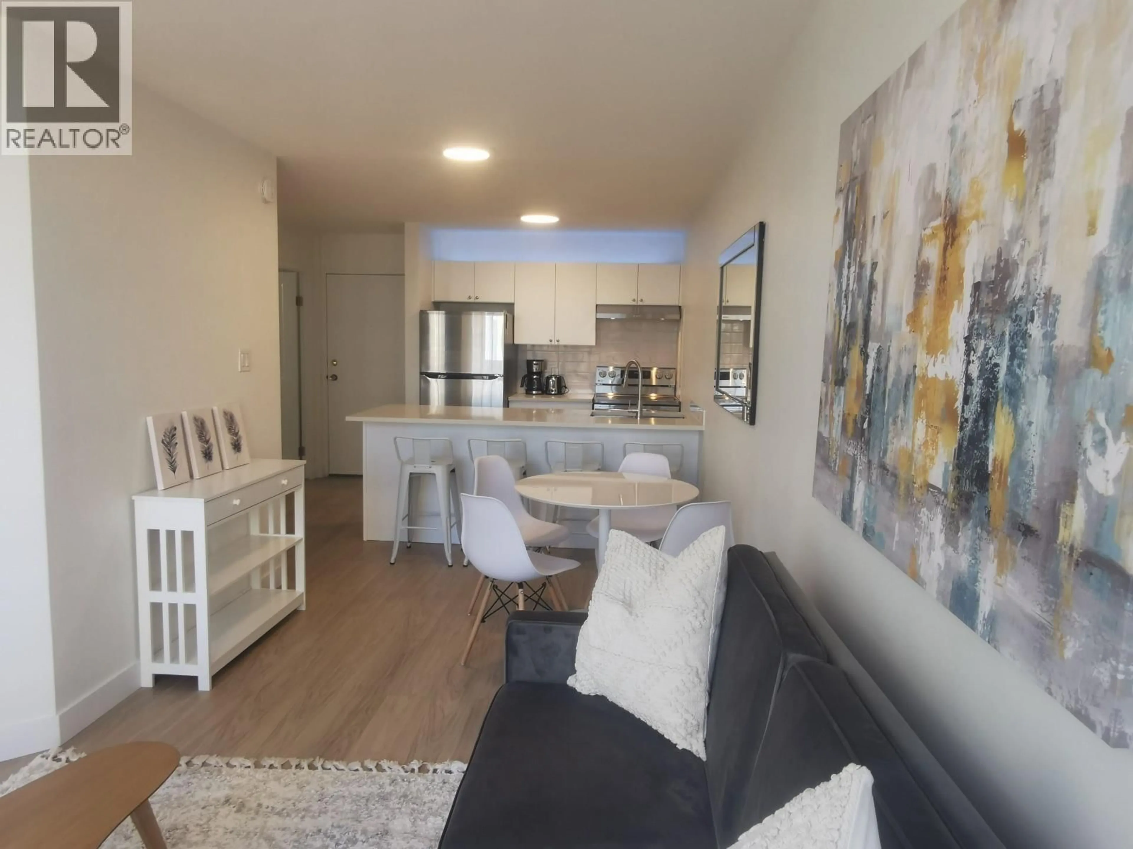 Living room with furniture, wood/laminate floor for 806 - 1330 BURRARD STREET, Vancouver British Columbia V6Z2B8