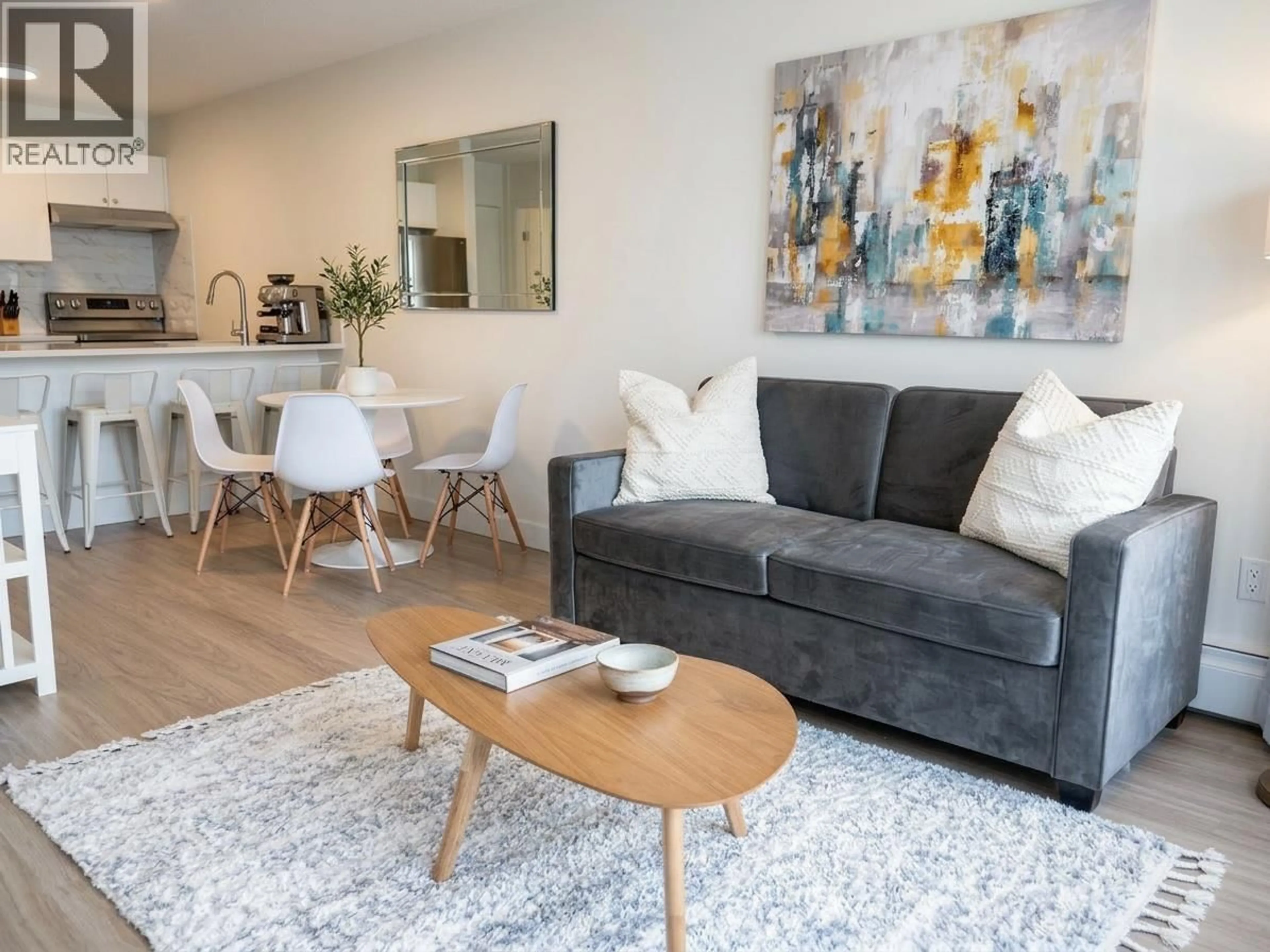 Living room with furniture, wood/laminate floor for 806 - 1330 BURRARD STREET, Vancouver British Columbia V6Z2B8