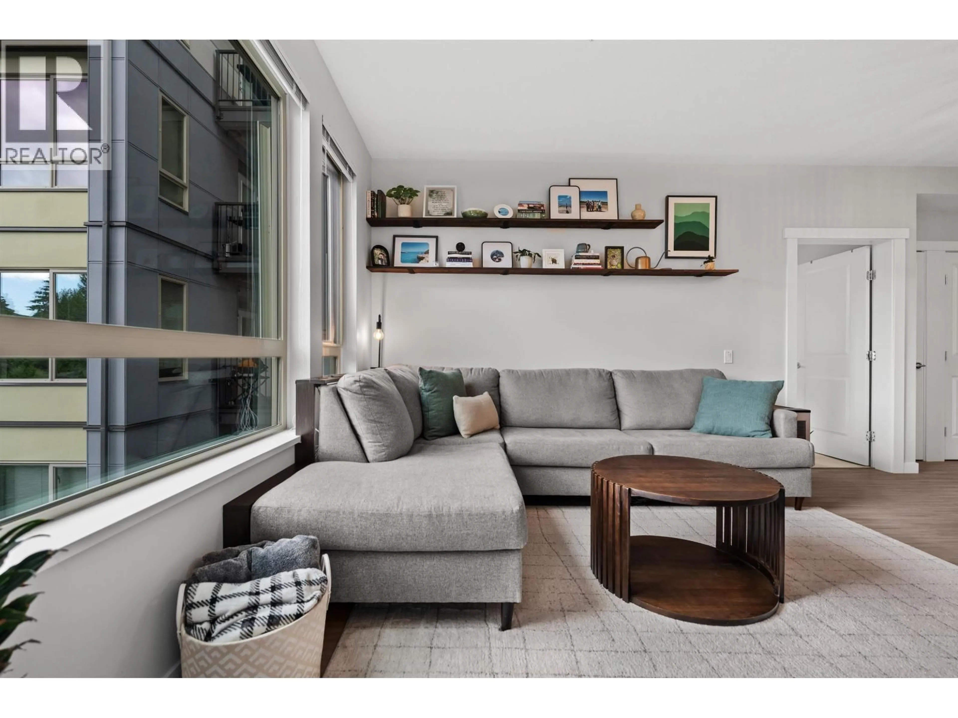 Living room with furniture, wood/laminate floor for 315 - 2651 LIBRARY LANE, North Vancouver British Columbia V7J0C1