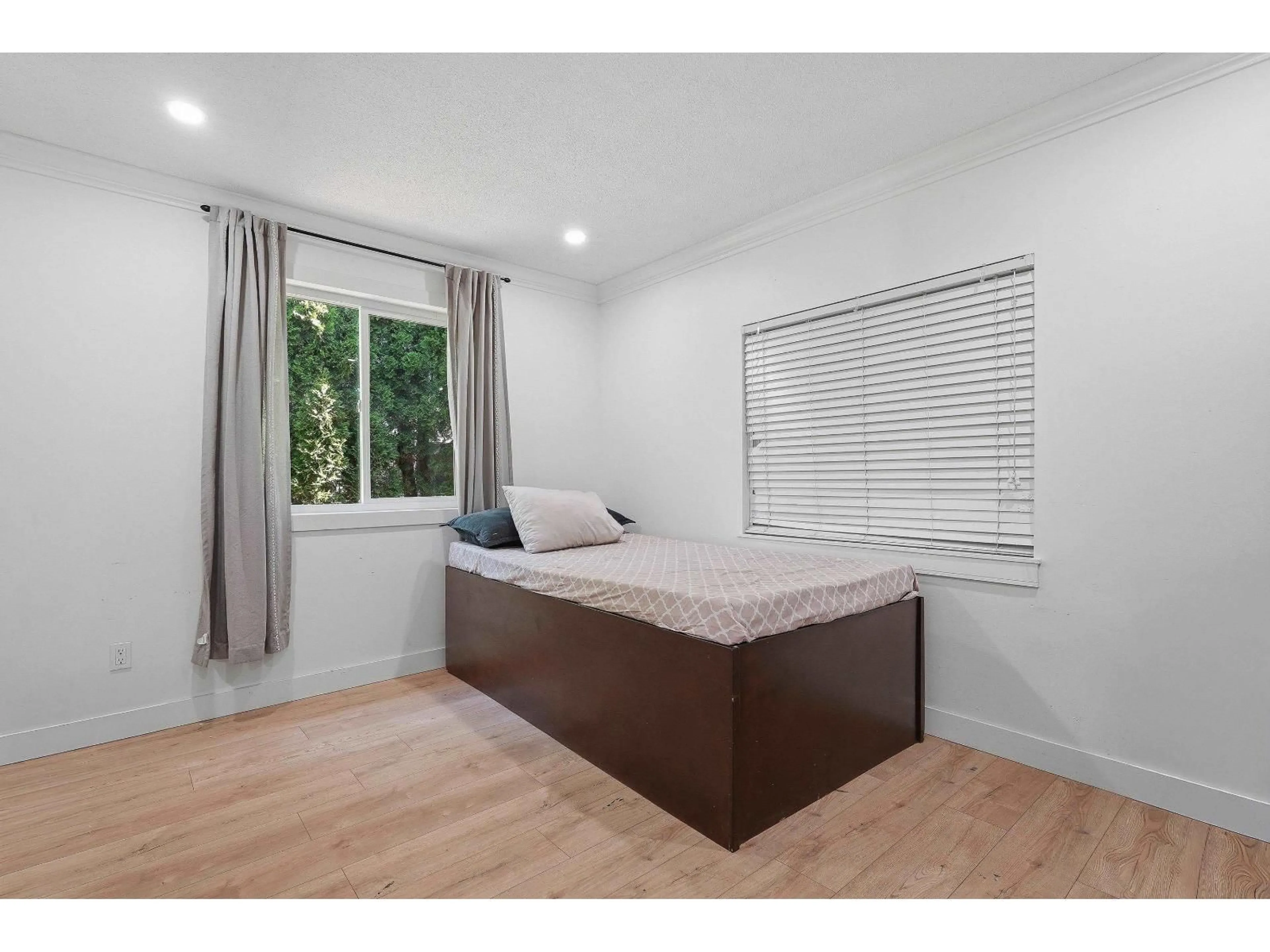 Bedroom with bed, wood/laminate floor for 8581 152 STREET, Surrey British Columbia V3S3M9