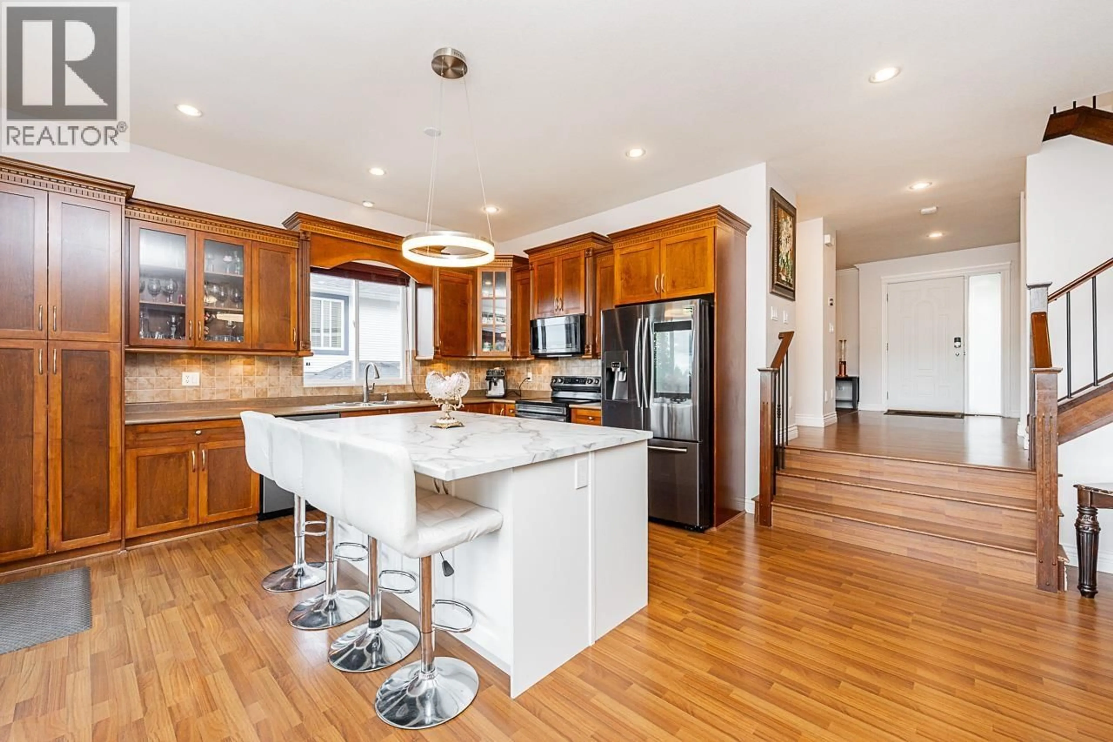 Open concept kitchen, wood/laminate floor for 24382 104 AVENUE, Maple Ridge British Columbia V2W2C4