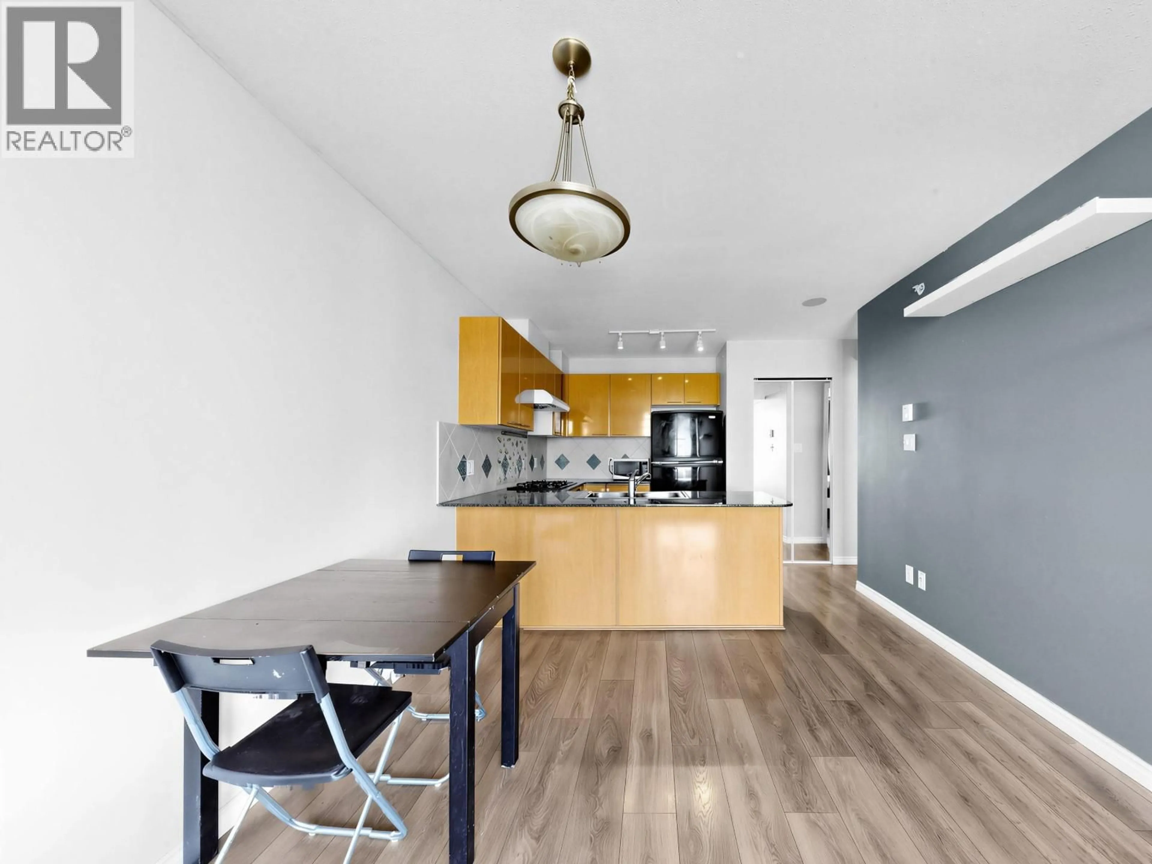 Open concept kitchen, wood/laminate floor for 704 - 5933 COONEY ROAD, Richmond British Columbia V6X4H3