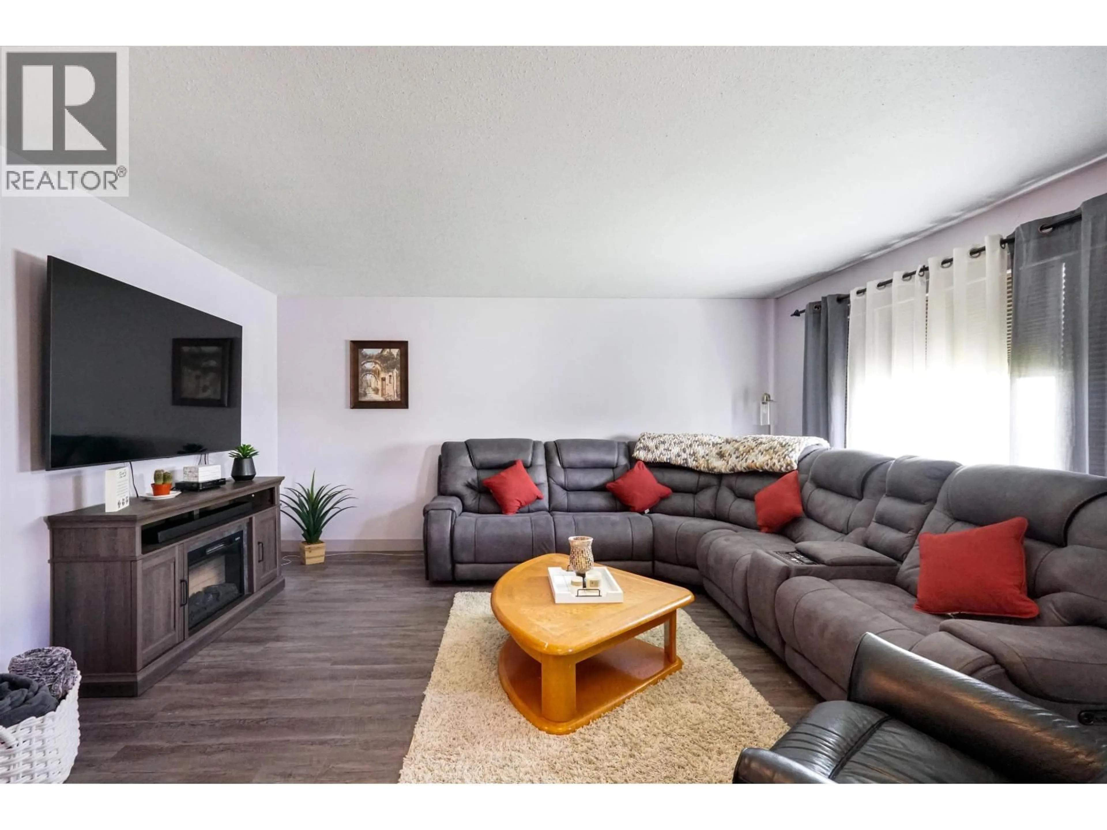 Living room with furniture, wood/laminate floor for 16 CARSWELL STREET, Kitimat British Columbia V8C1B3