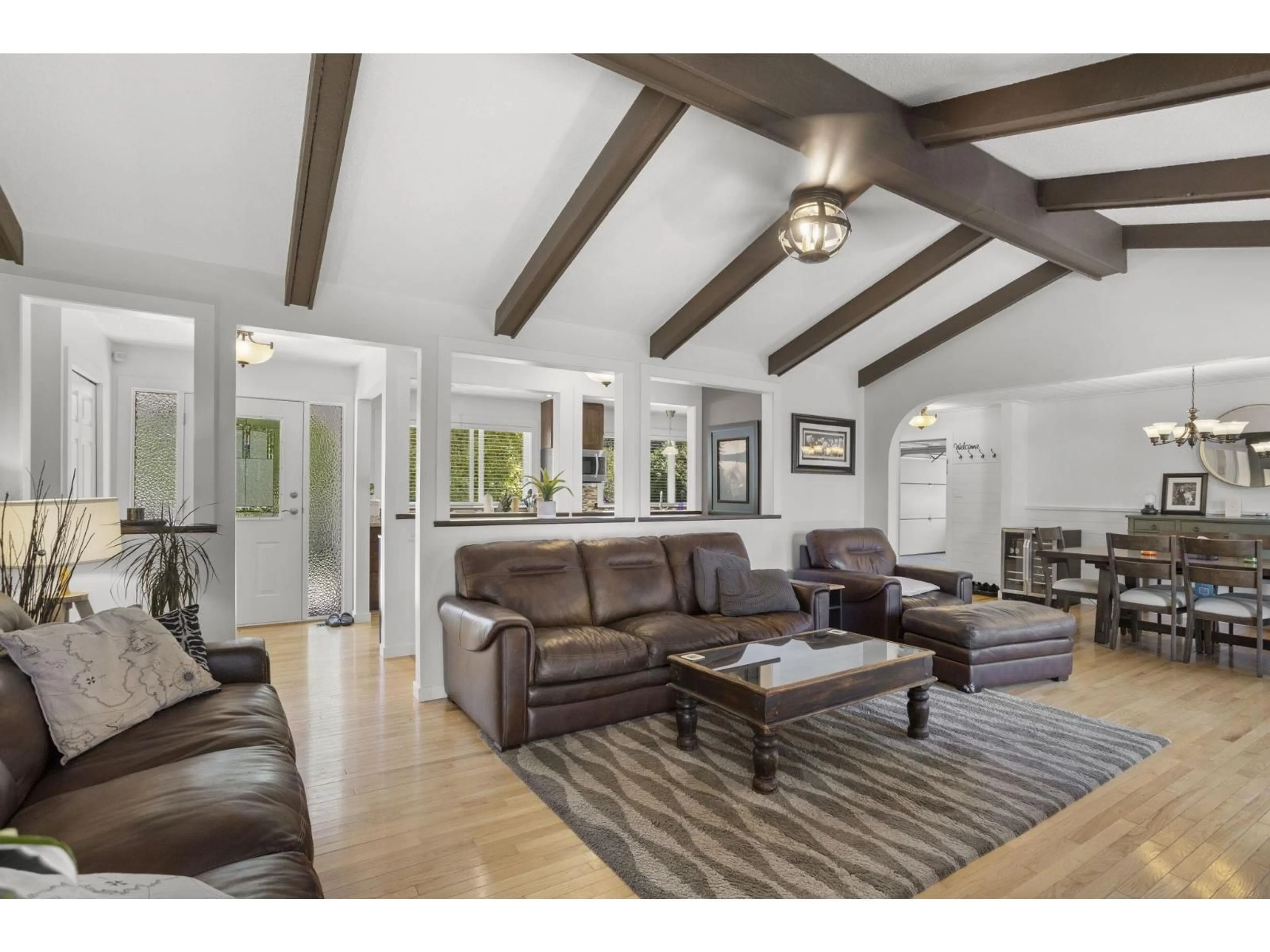 Living room with furniture, wood/laminate floor for 34629 ASCOTT AVENUE, Abbotsford British Columbia V2S5A3