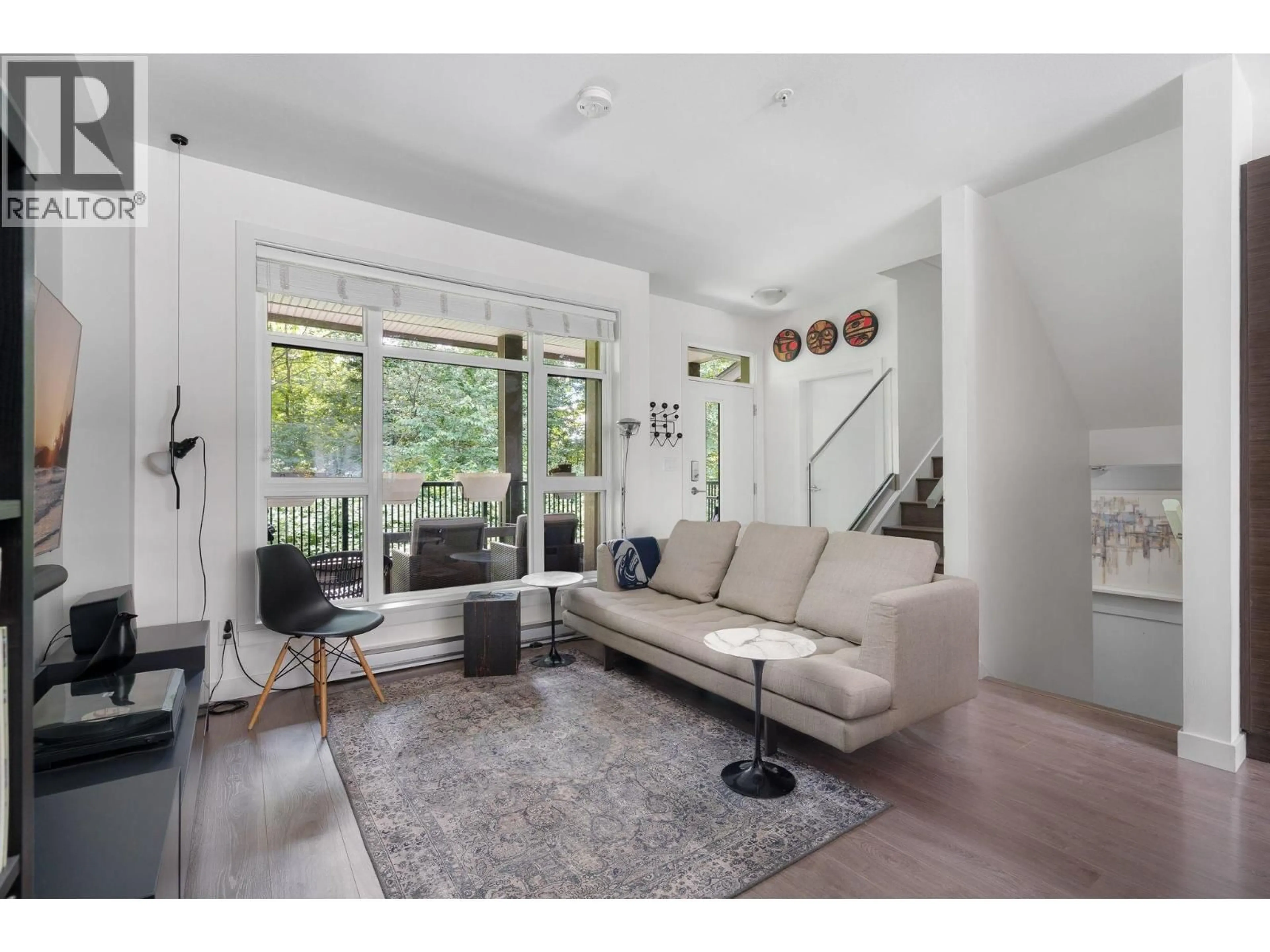 Living room with furniture, unknown for 307 - 2135 HERITAGE PARK LANE, North Vancouver British Columbia V7H0B6