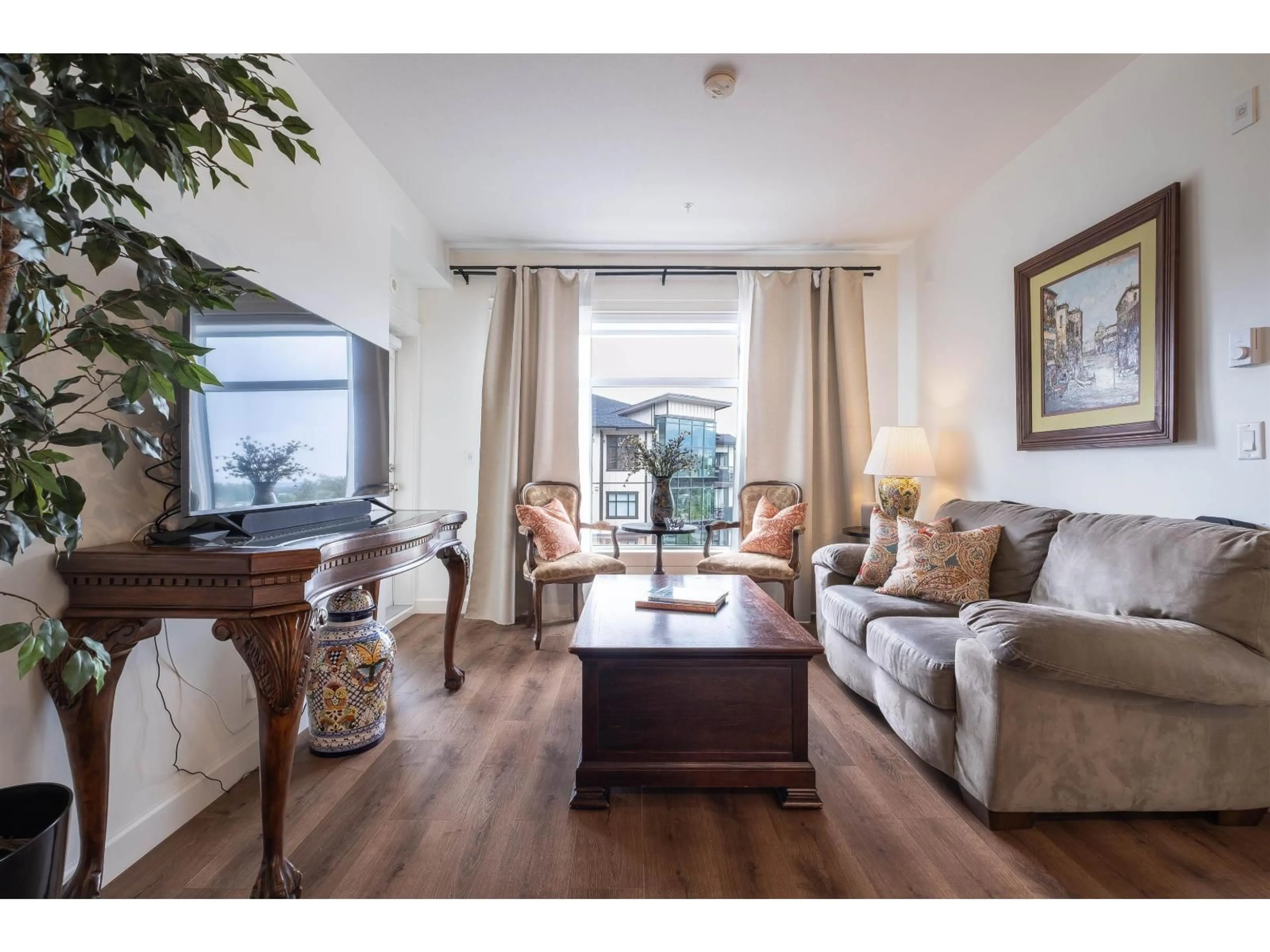 Living room with furniture, wood/laminate floor for 513 - 20376 86 AVENUE, Langley British Columbia V2Y3P8