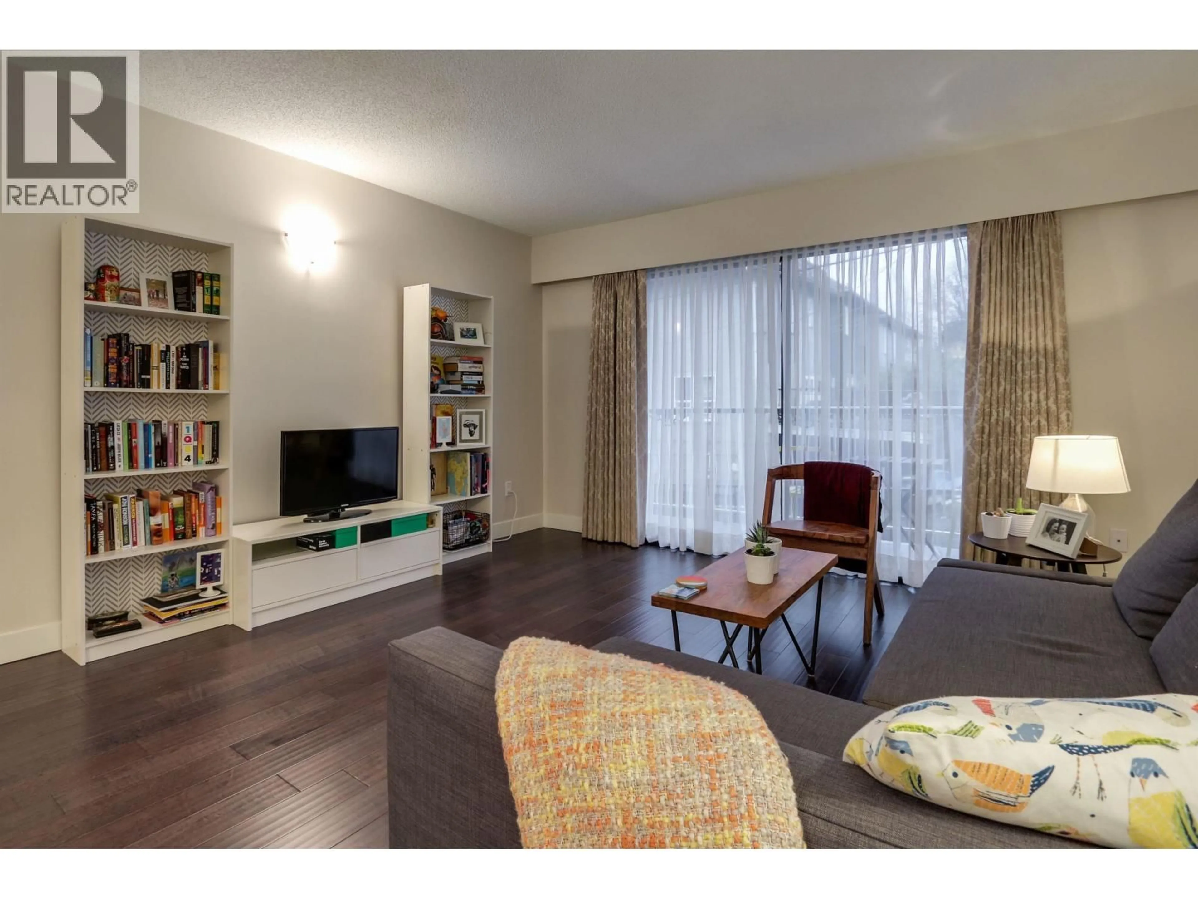 Living room with furniture, wood/laminate floor for 203 - 1611 3RD AVENUE, Vancouver British Columbia V5N1H1