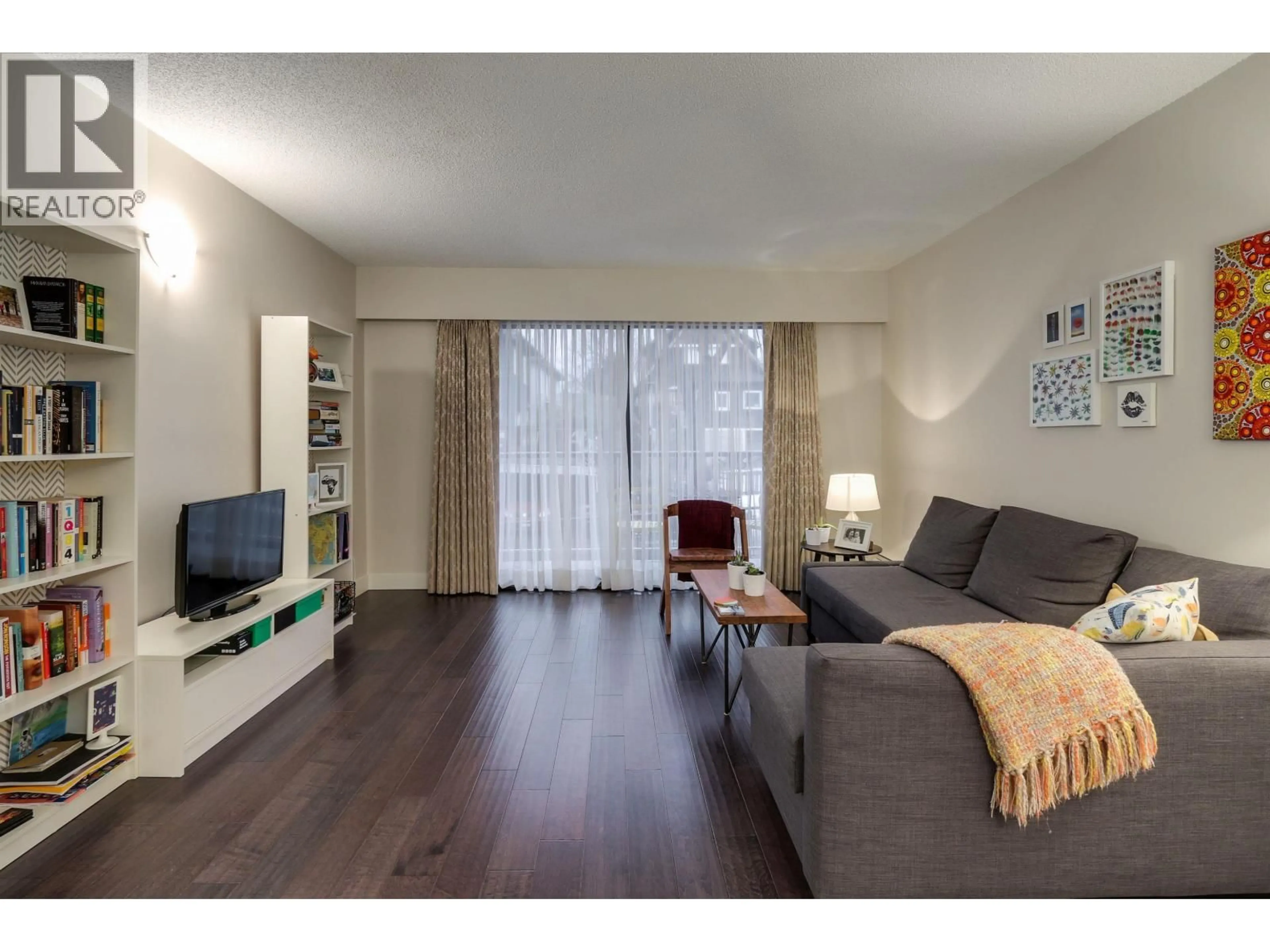 Living room with furniture, wood/laminate floor for 203 - 1611 3RD AVENUE, Vancouver British Columbia V5N1H1