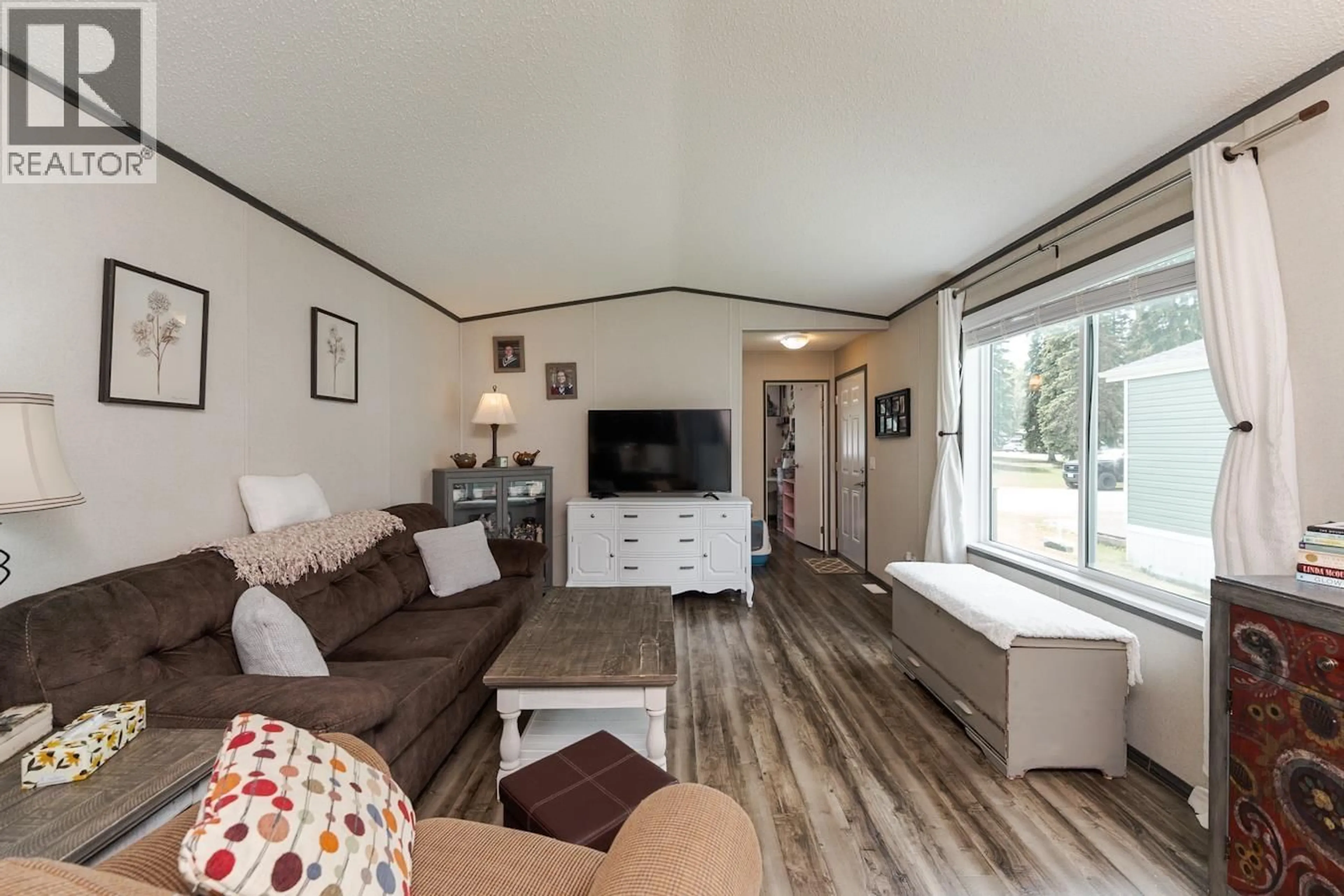 Living room with furniture, wood/laminate floor for 13 - 8474 BUNCE ROAD, Prince George British Columbia V2N6P1