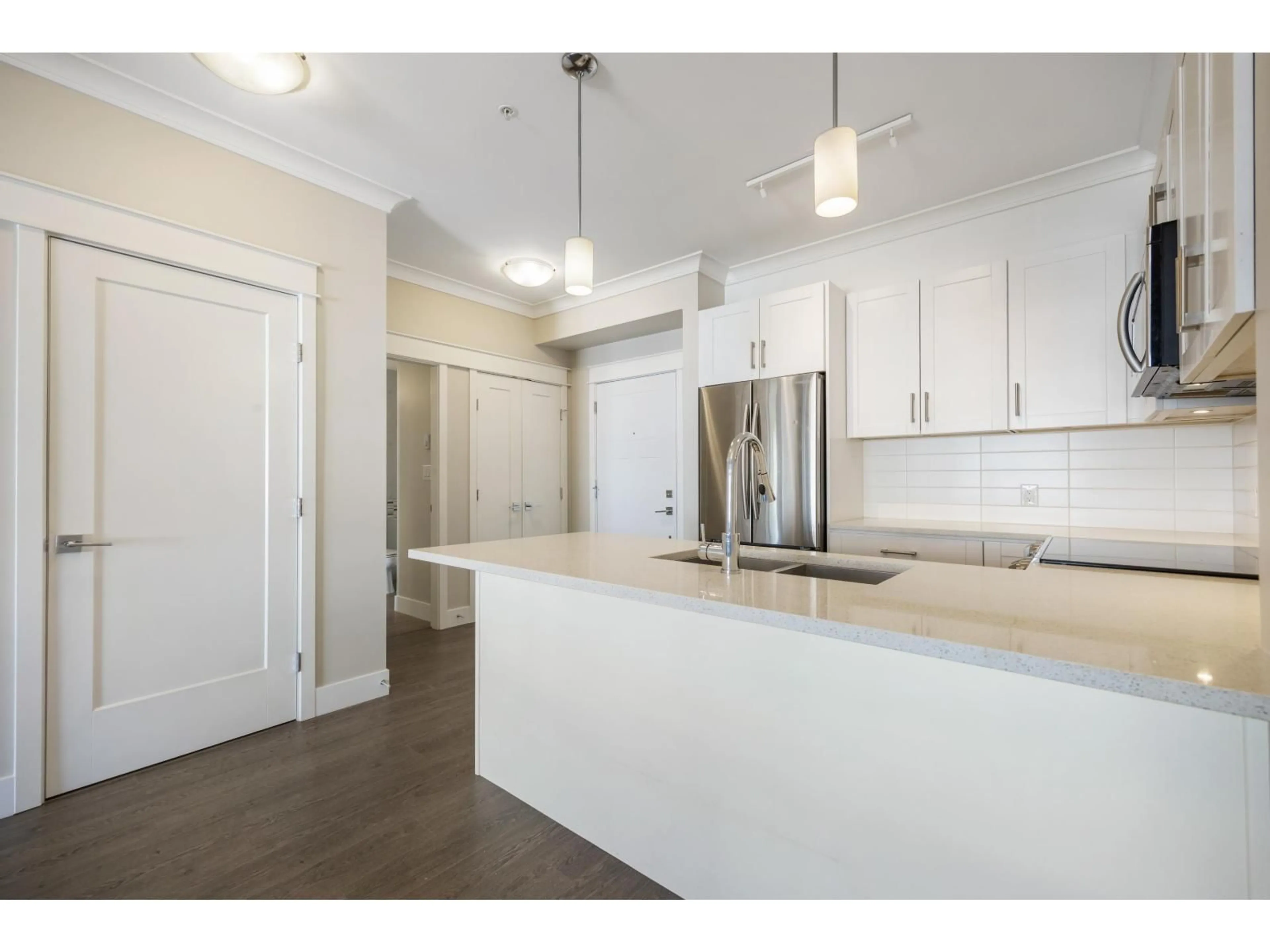 Open concept kitchen, wood/laminate floor for 306 - 5020 221A STREET, Langley British Columbia V2Y0V5