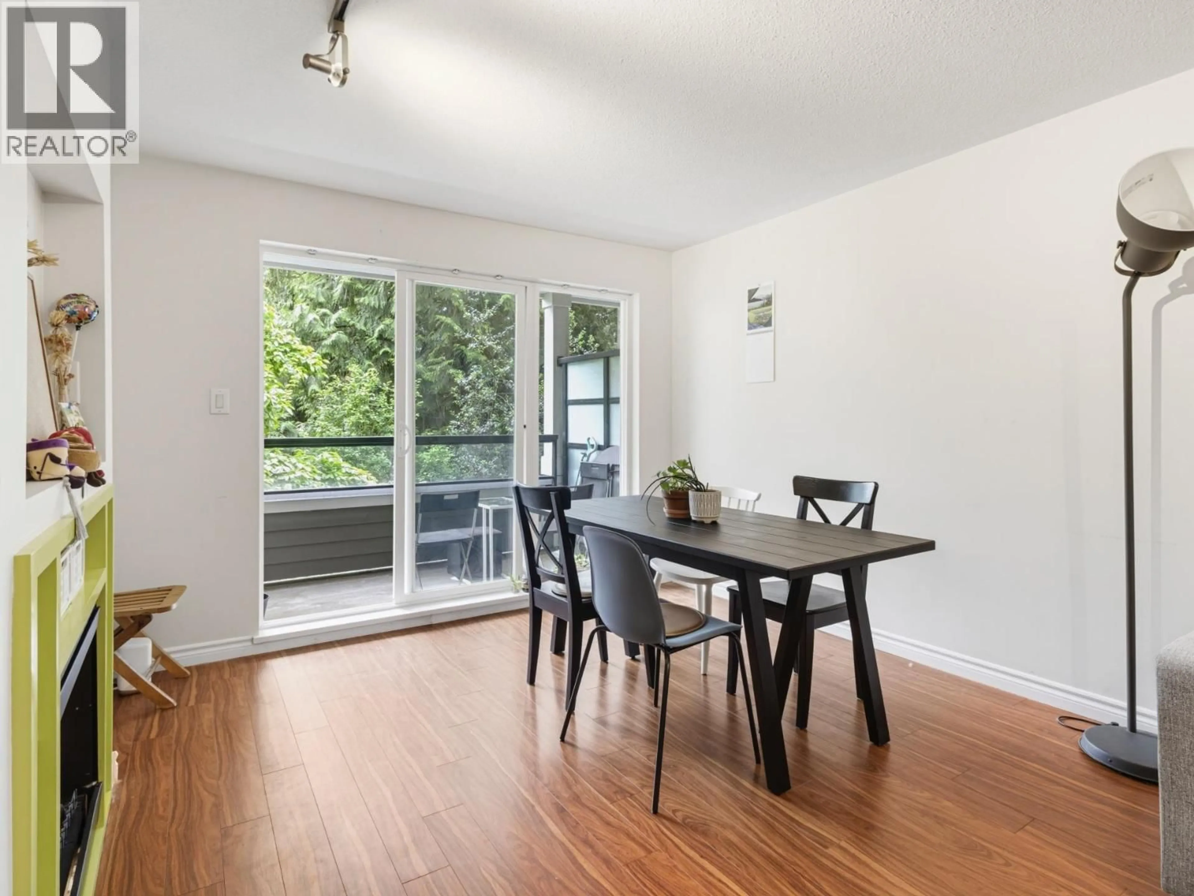 Dining room, wood/laminate floor for 202 - 6888 SOUTHPOINT DRIVE, Burnaby British Columbia V3N5E3