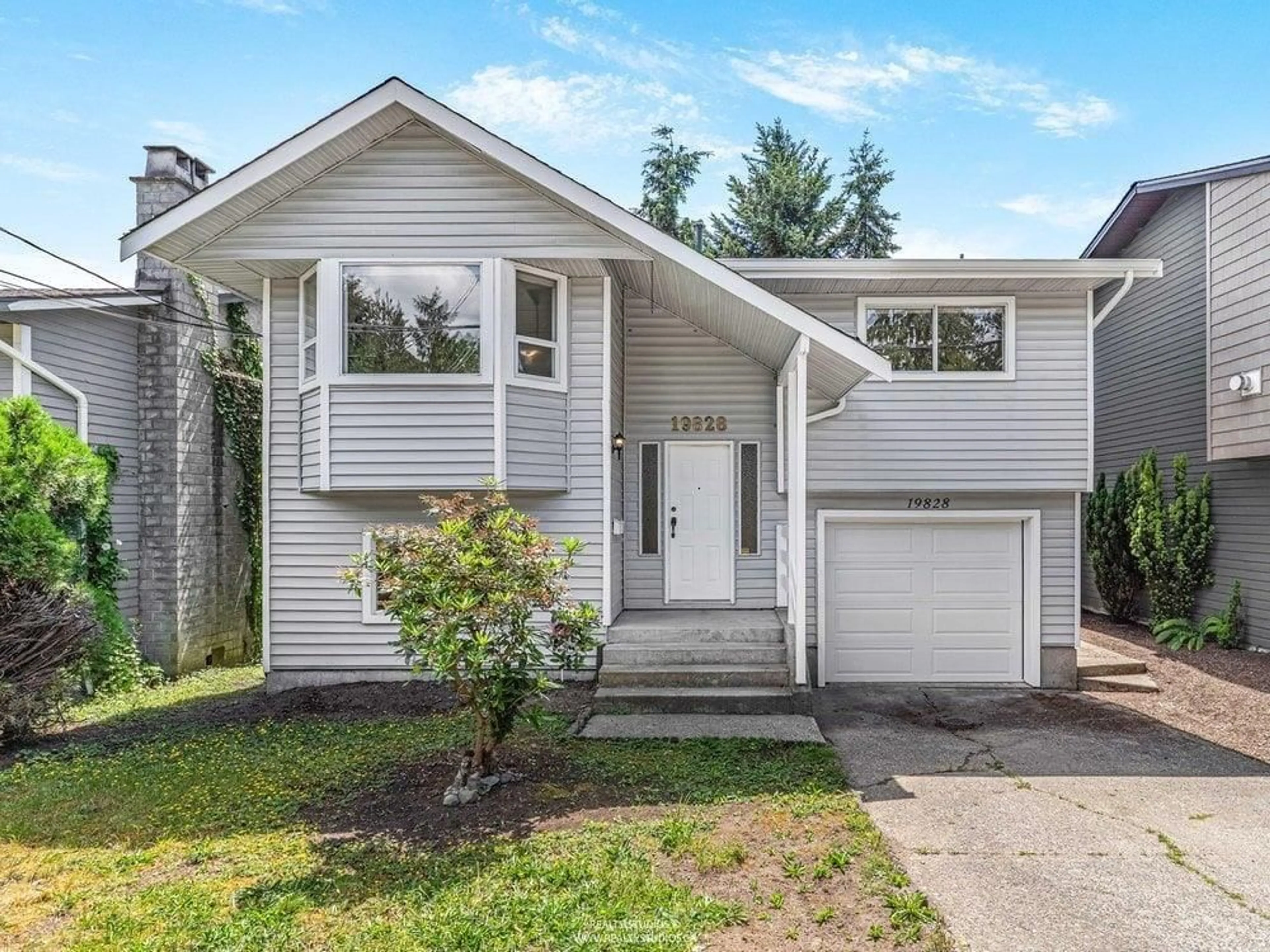 Home with vinyl exterior material, street for 19828 68 AVENUE, Langley British Columbia V2Y1H7