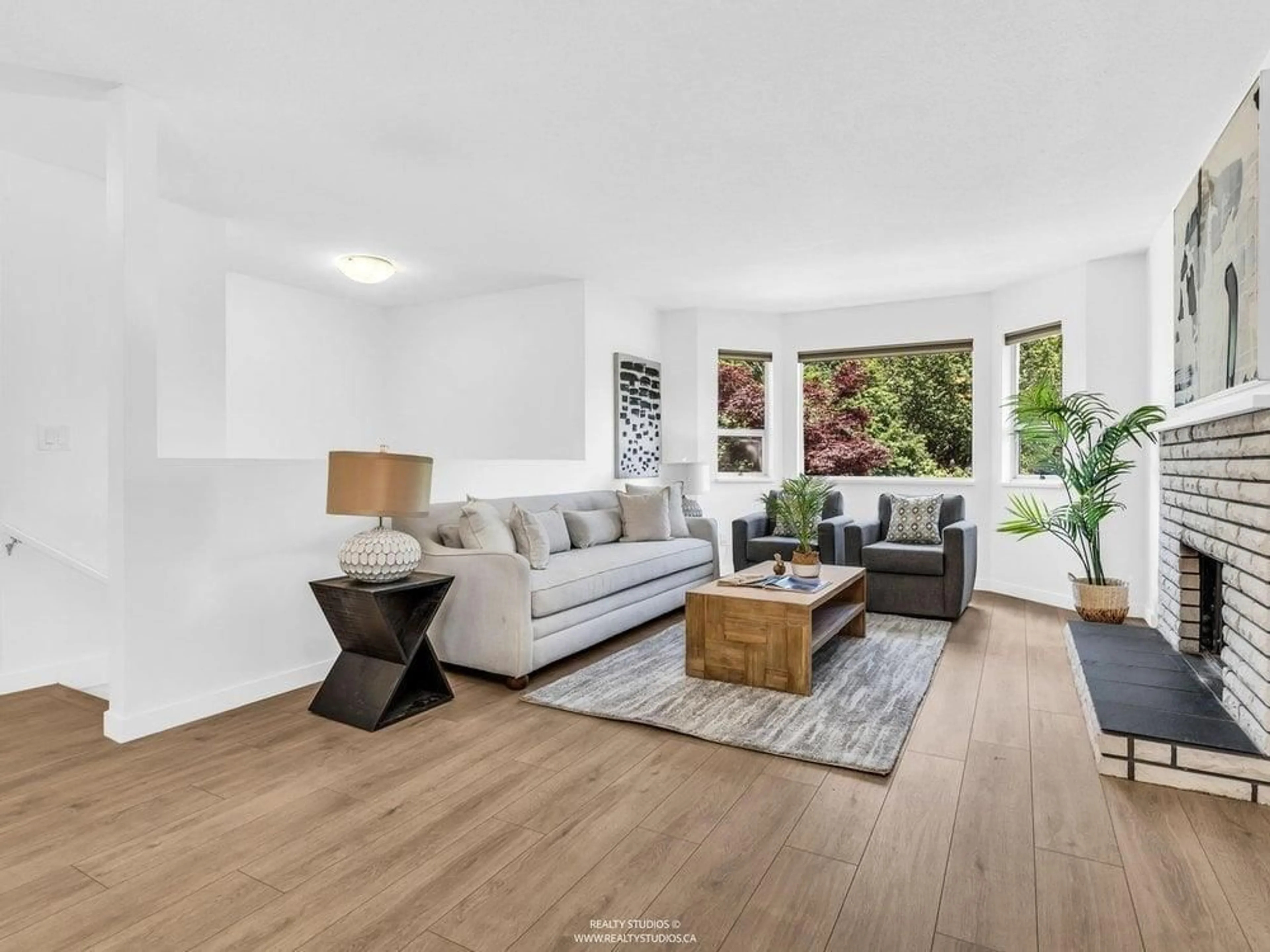 Living room with furniture, wood/laminate floor for 19828 68 AVENUE, Langley British Columbia V2Y1H7