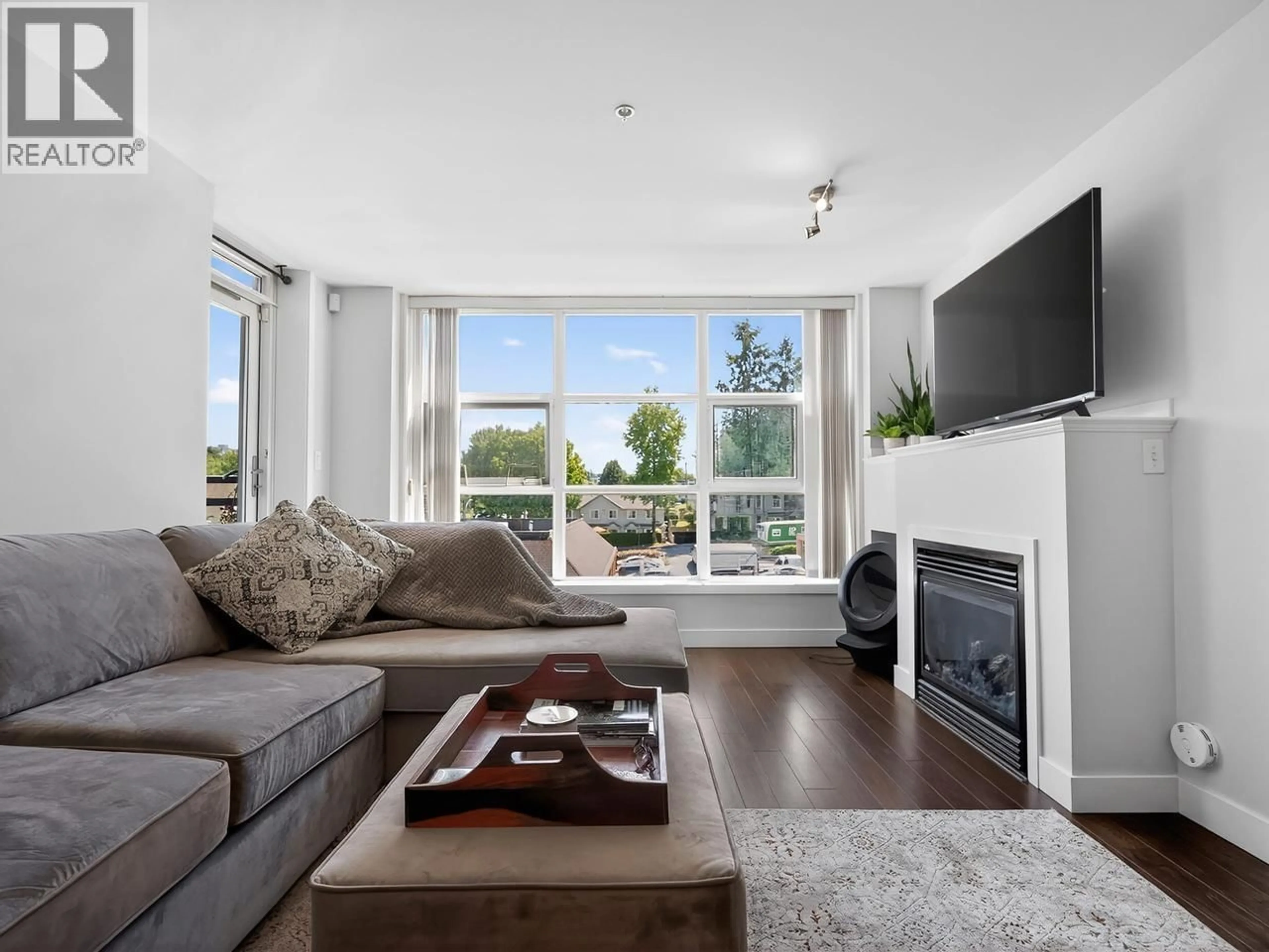 Living room with furniture, wood/laminate floor for 411 - 3255 SMITH AVENUE, Burnaby British Columbia V5G0B5