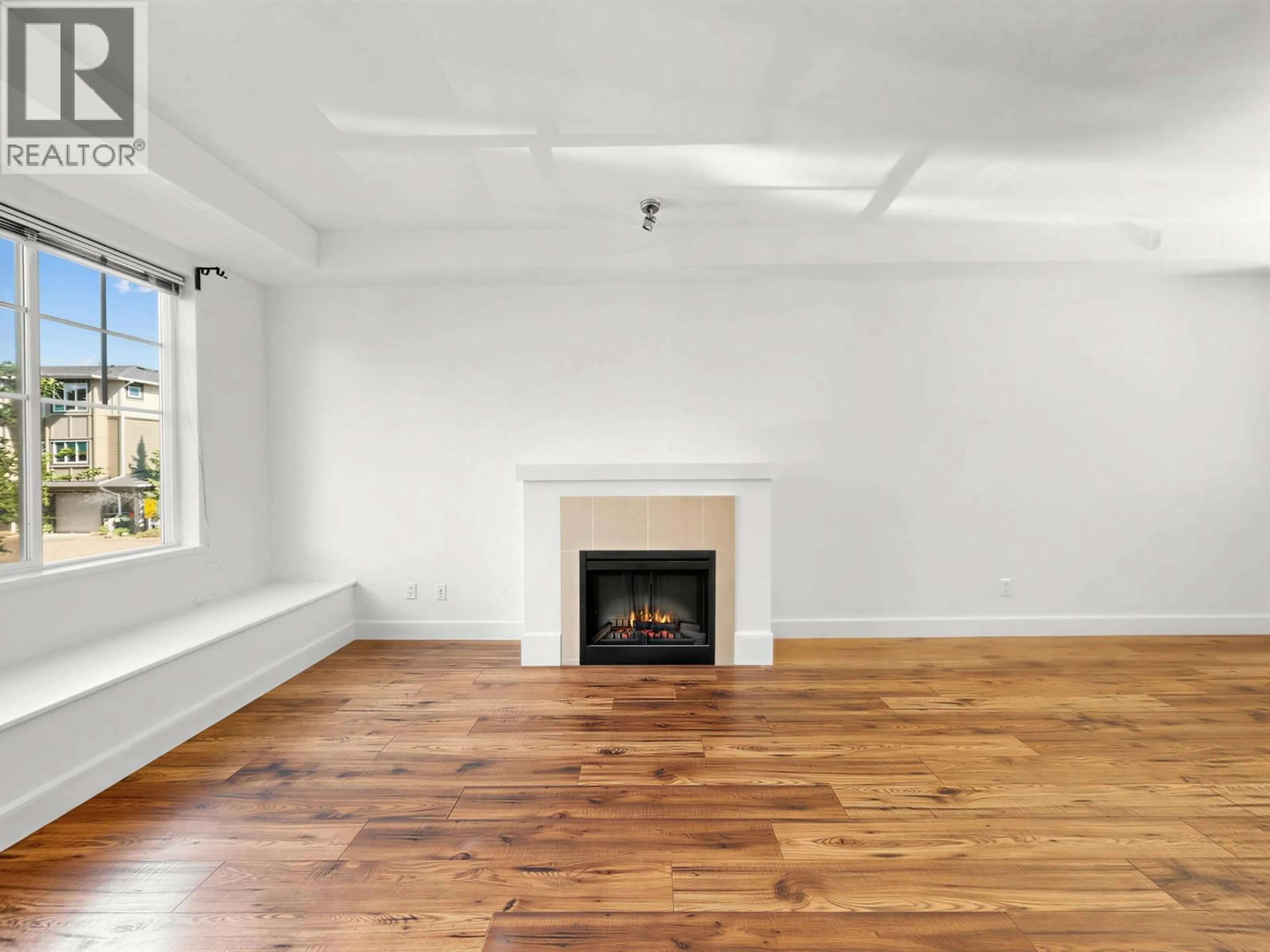 Living room with furniture, wood/laminate floor for 15 - 7331 HEATHER STREET, Richmond British Columbia V6Y4M3