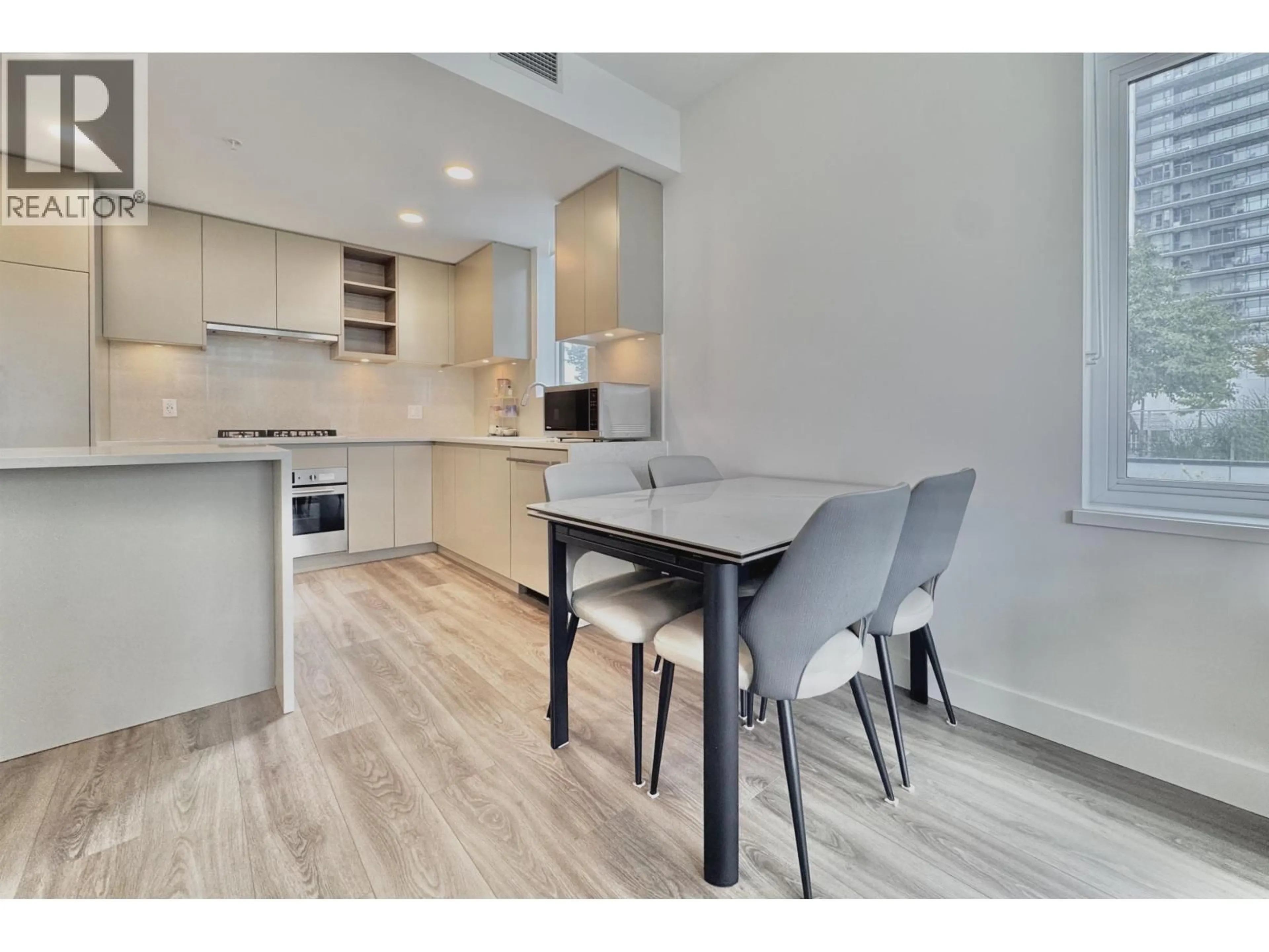 Open concept kitchen, wood/laminate floor for 301 - 4433 ALASKA STREET, Burnaby British Columbia V5C5T3