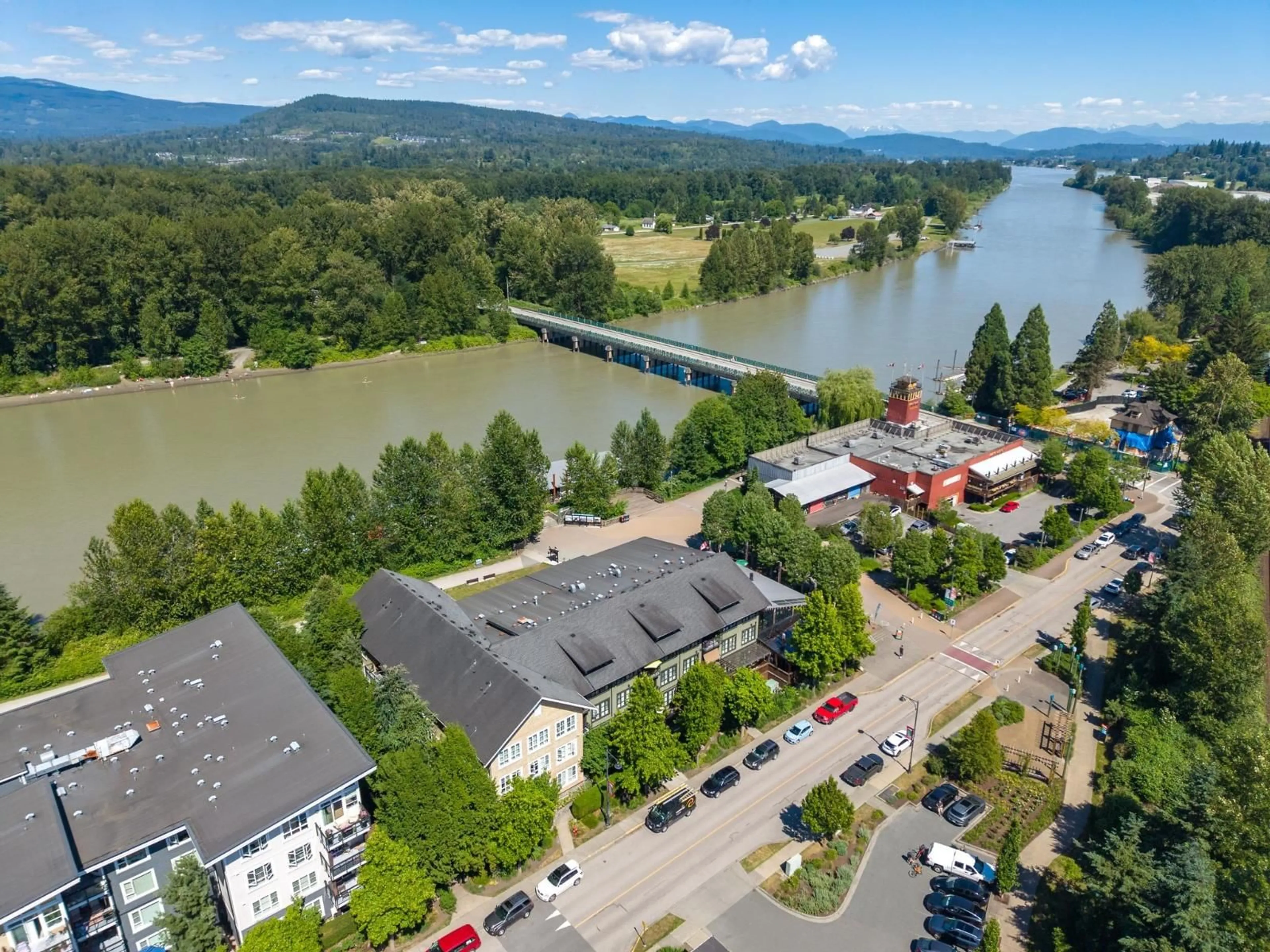 A pic from outside/outdoor area/front of a property/back of a property/a pic from drone, water/lake/river/ocean view for 208 - 23285 BILLY BROWN ROAD, Langley British Columbia V1M0C8
