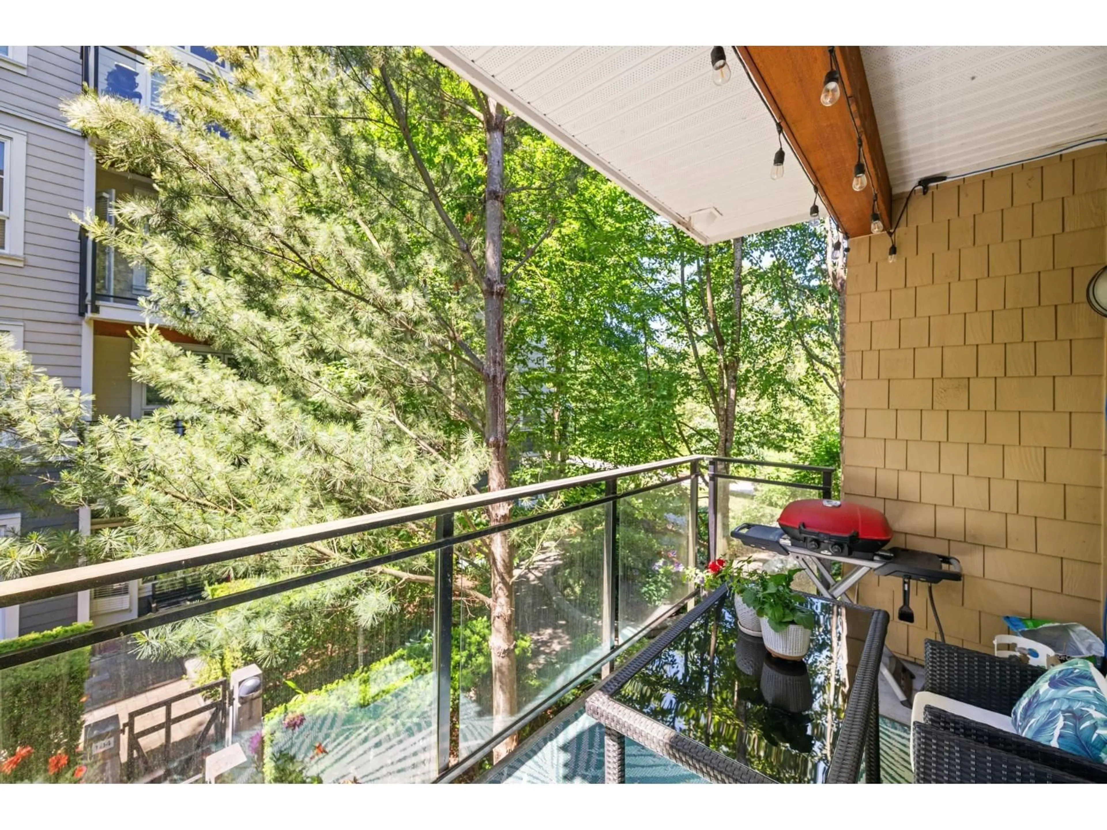 Balcony in the apartment, forest/trees view for 208 - 23285 BILLY BROWN ROAD, Langley British Columbia V1M0C8