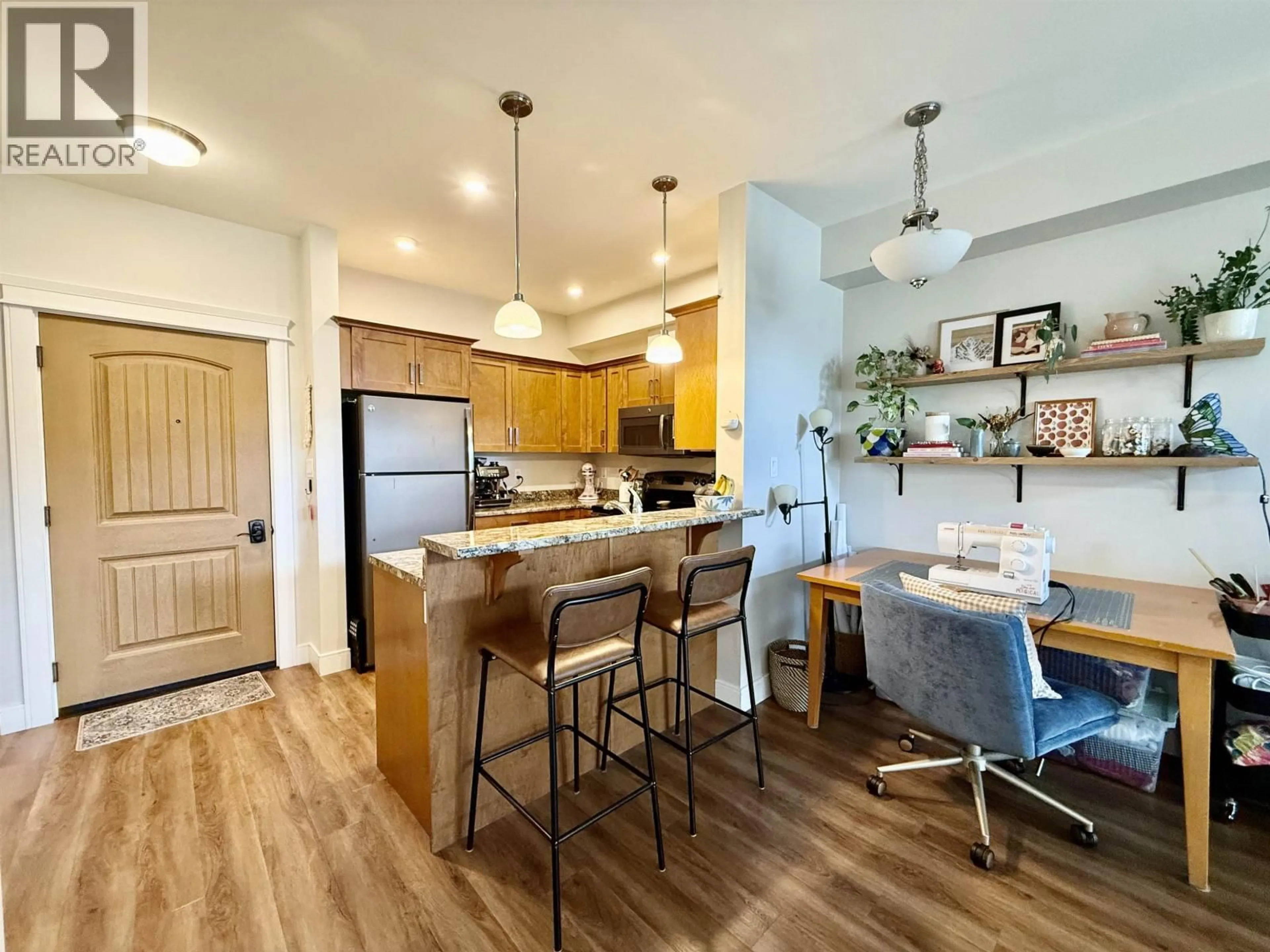 Open concept kitchen, wood/laminate floor for 104 - 3684 PRINCESS CRESCENT, Smithers British Columbia V0J2N0
