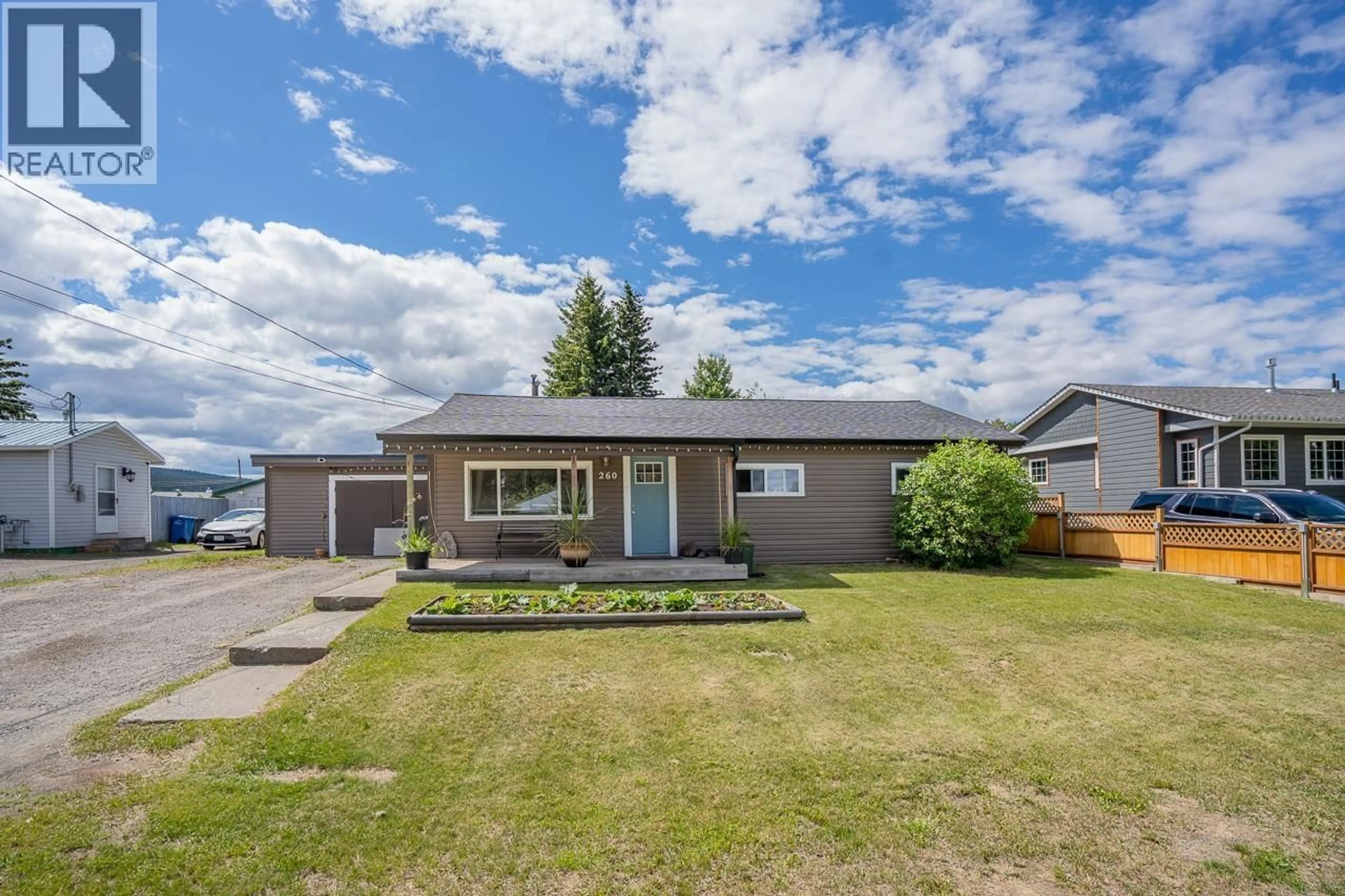 A pic from outside/outdoor area/front of a property/back of a property/a pic from drone, street for 260 DOGWOOD AVENUE, 100 Mile House British Columbia V0K2E0