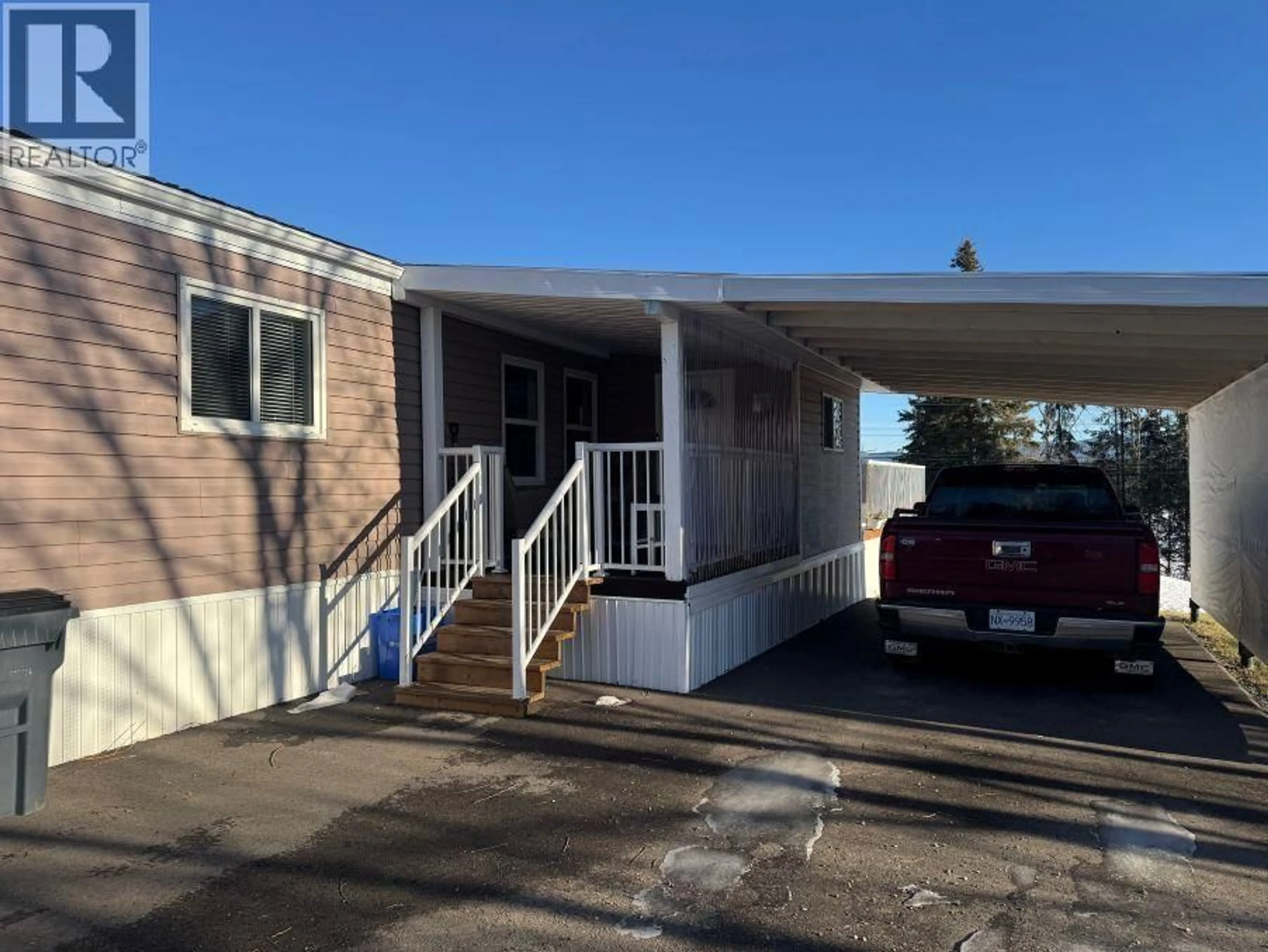 Home with vinyl exterior material, street for 301 BLACKBURN ROAD, Prince George British Columbia V2N6G1