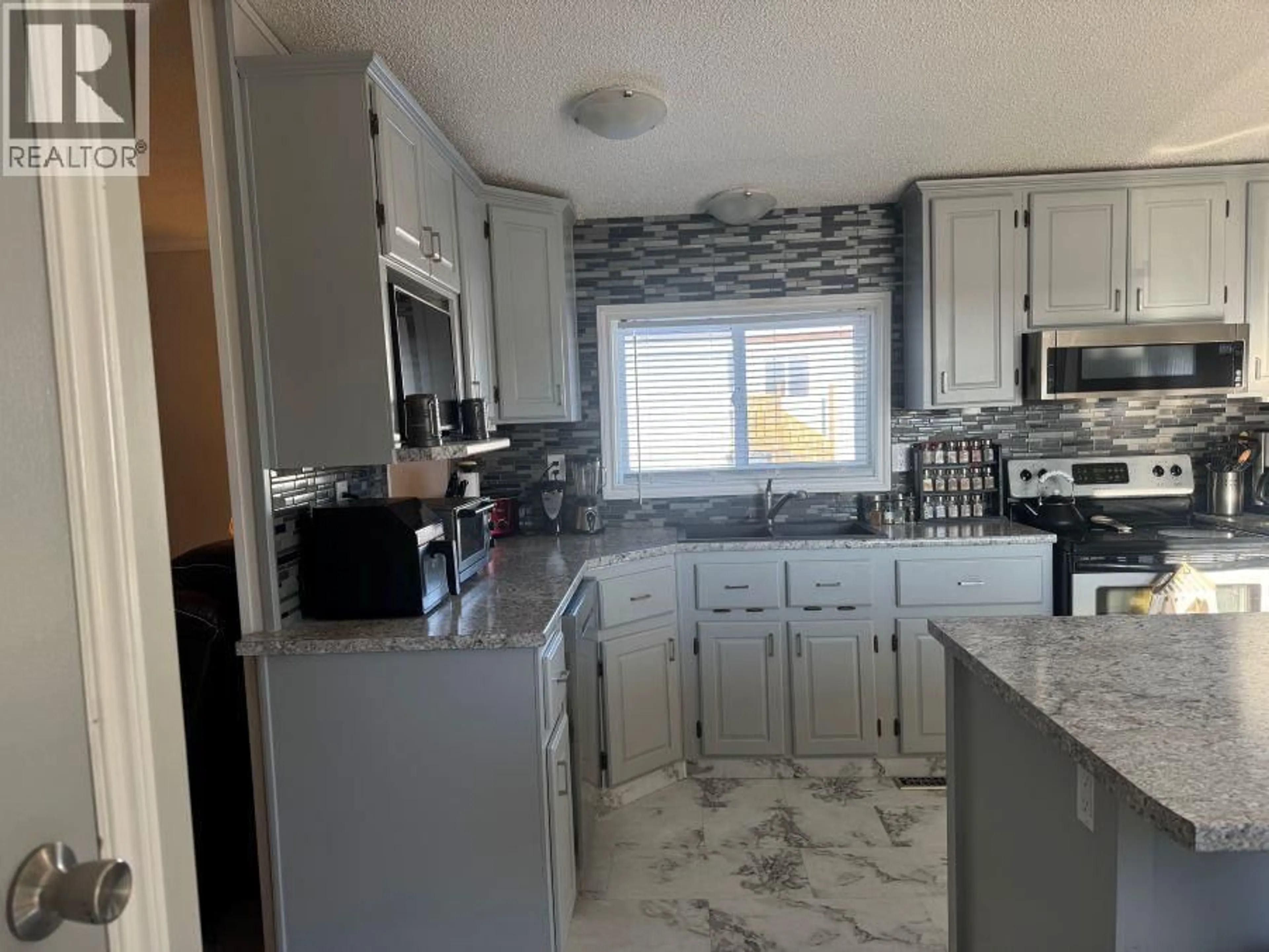 Open concept kitchen, ceramic/tile floor for 301 BLACKBURN ROAD, Prince George British Columbia V2N6G1