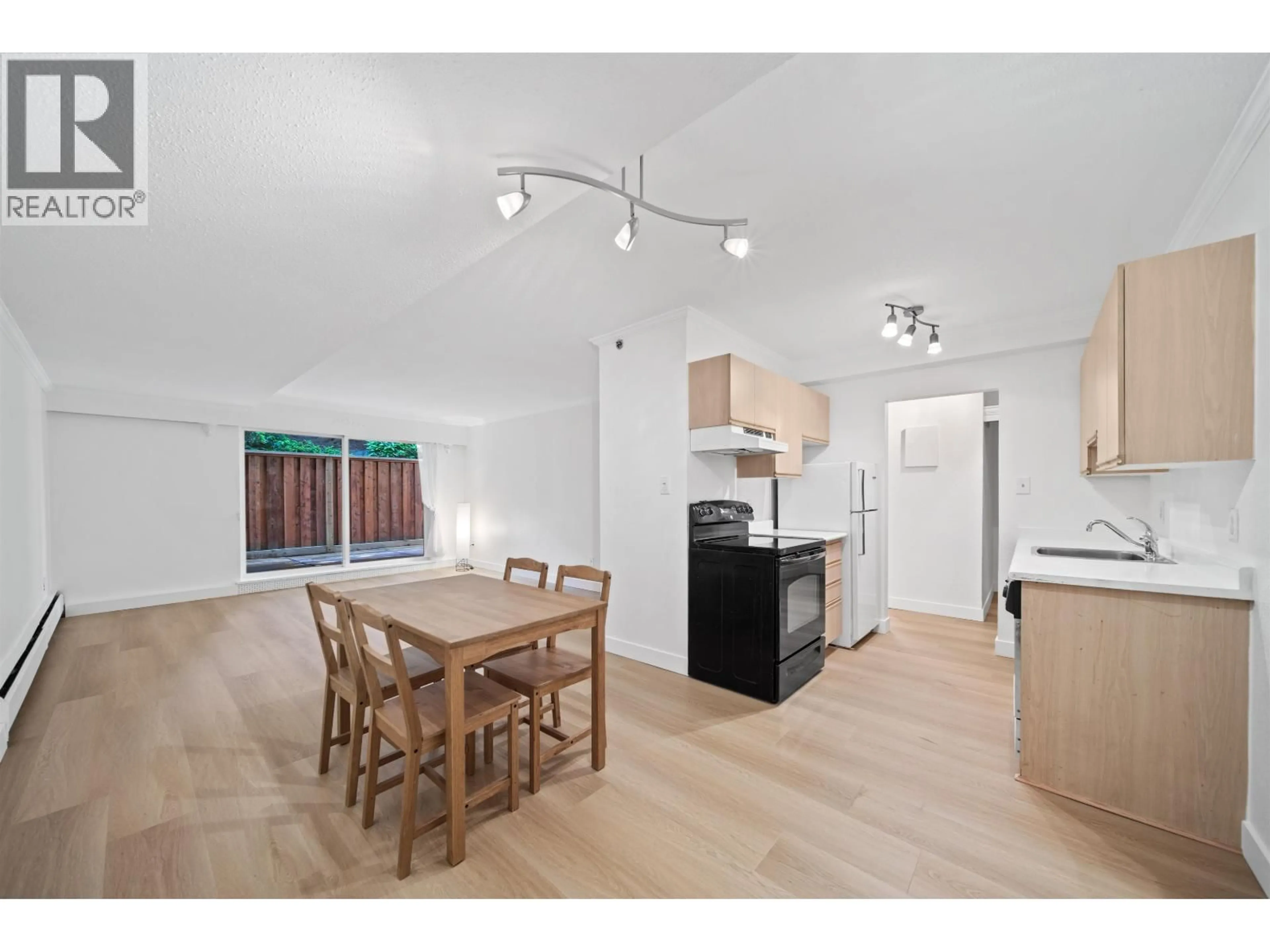 Open concept kitchen, wood/laminate floor for 606 - 756 GREAT NORTHERN WAY, Vancouver British Columbia V5T1E4