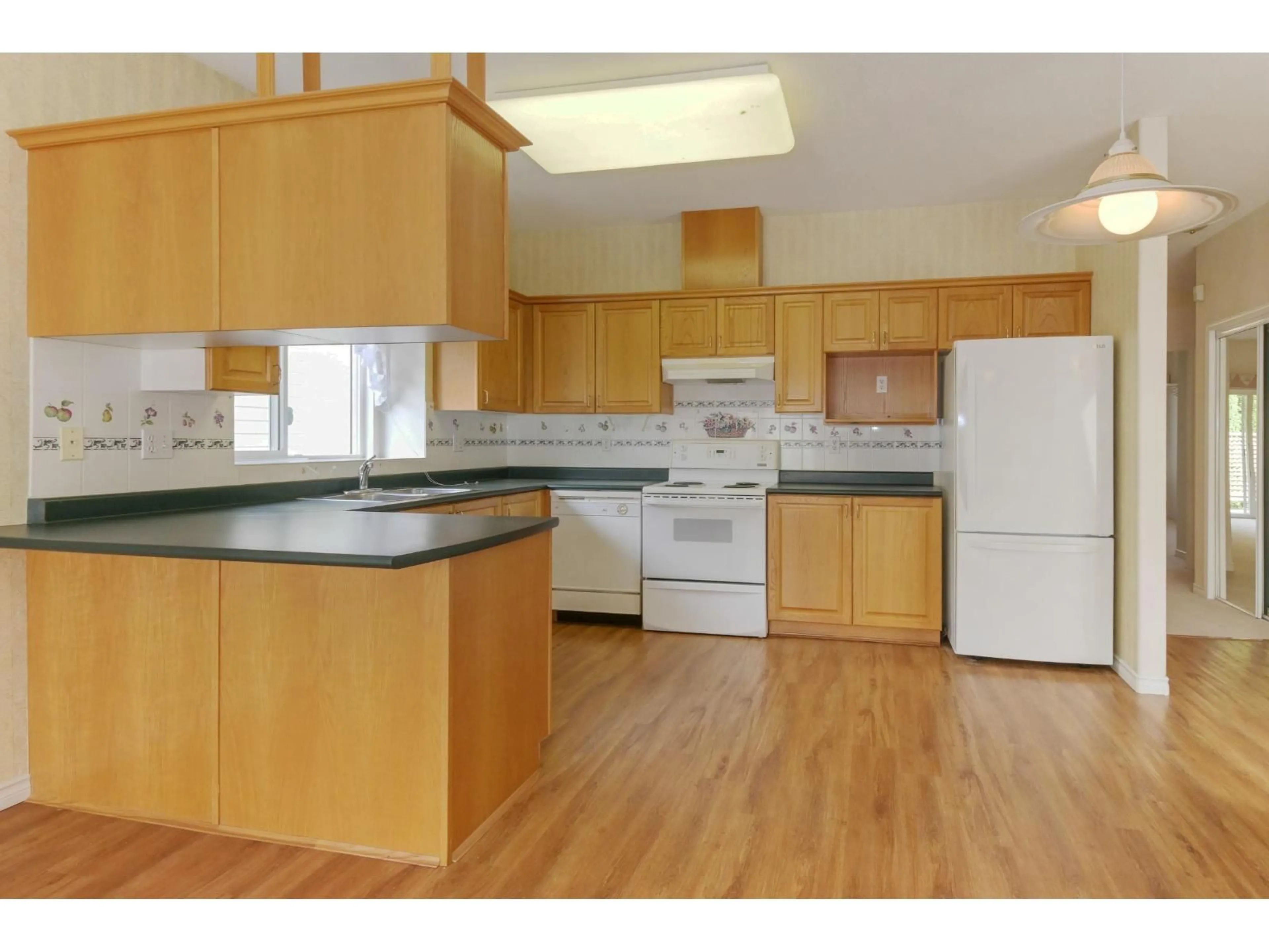 Standard kitchen, wood/laminate floor for 12 - 18939 65 AVENUE, Surrey British Columbia V3S8Y2