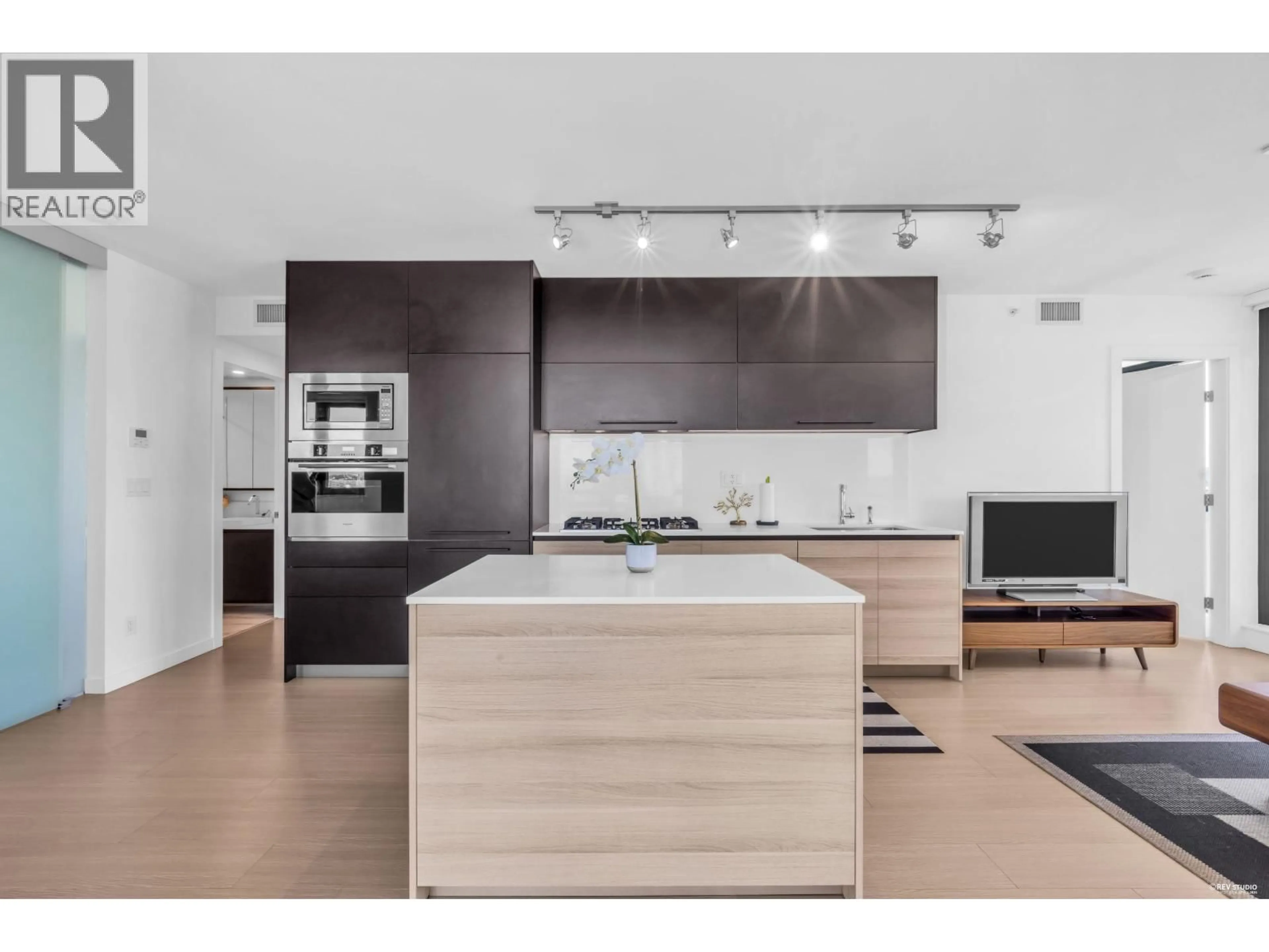 Open concept kitchen, wood/laminate floor for 1308 - 4488 JUNEAU STREET, Burnaby British Columbia V5C0M4
