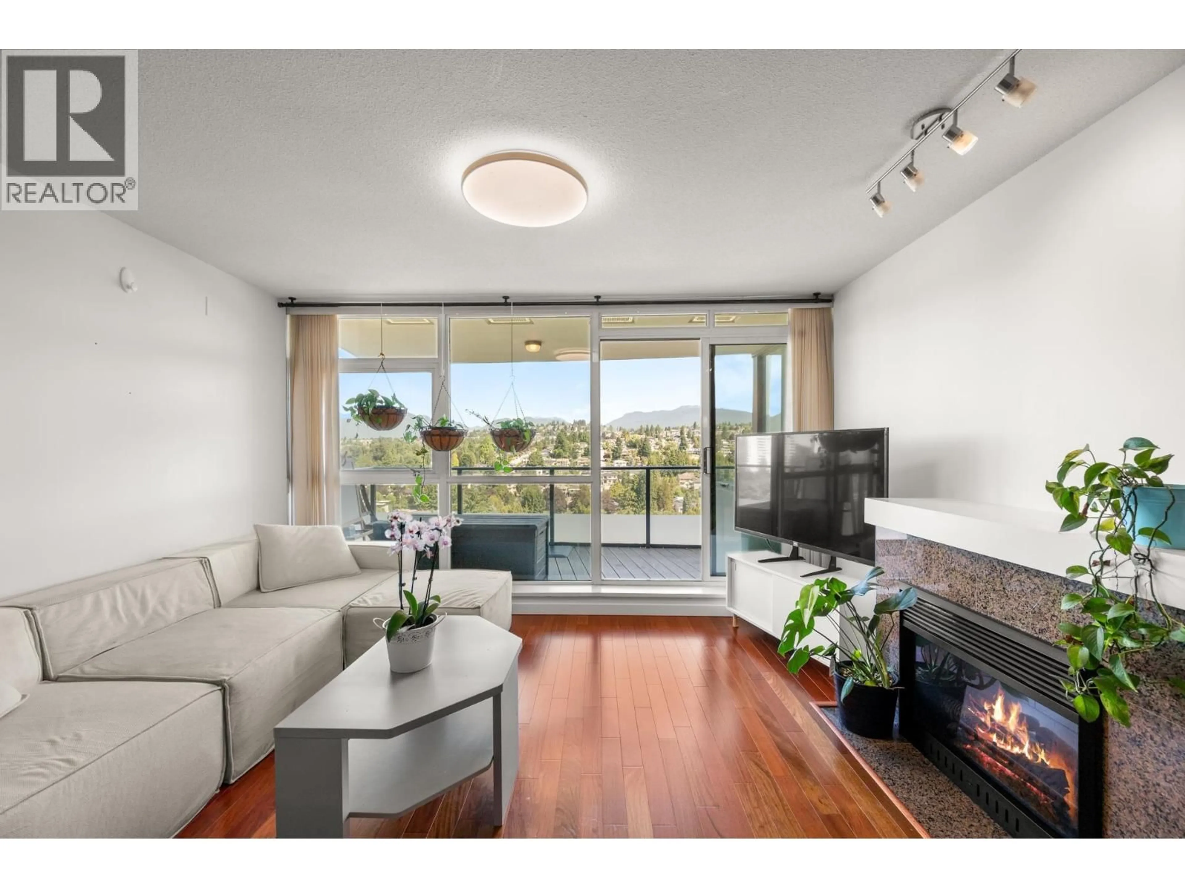 Living room with furniture, wood/laminate floor for 1801 - 5611 GORING STREET, Burnaby British Columbia V5B0A3
