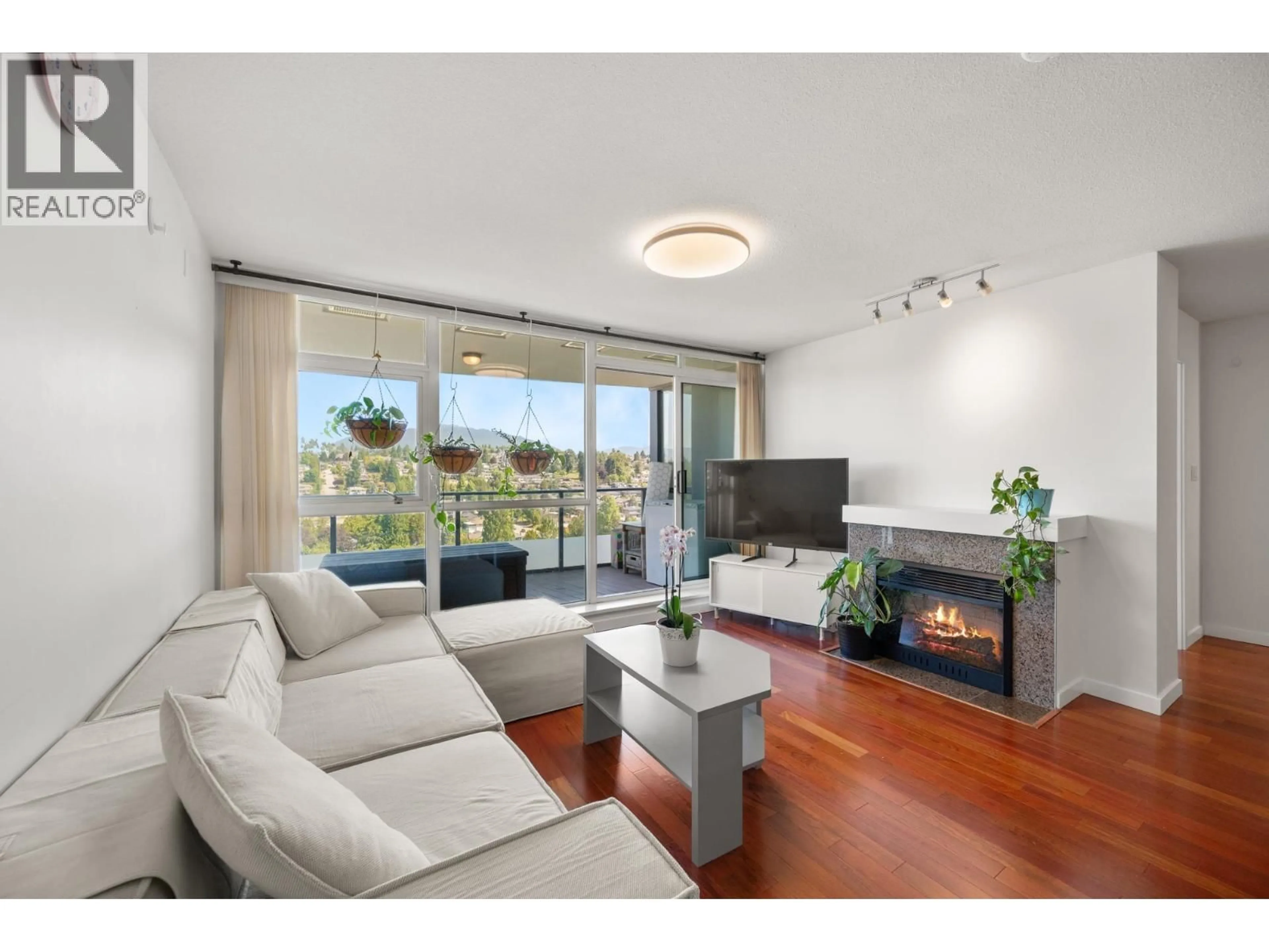 Living room with furniture, wood/laminate floor for 1801 - 5611 GORING STREET, Burnaby British Columbia V5B0A3
