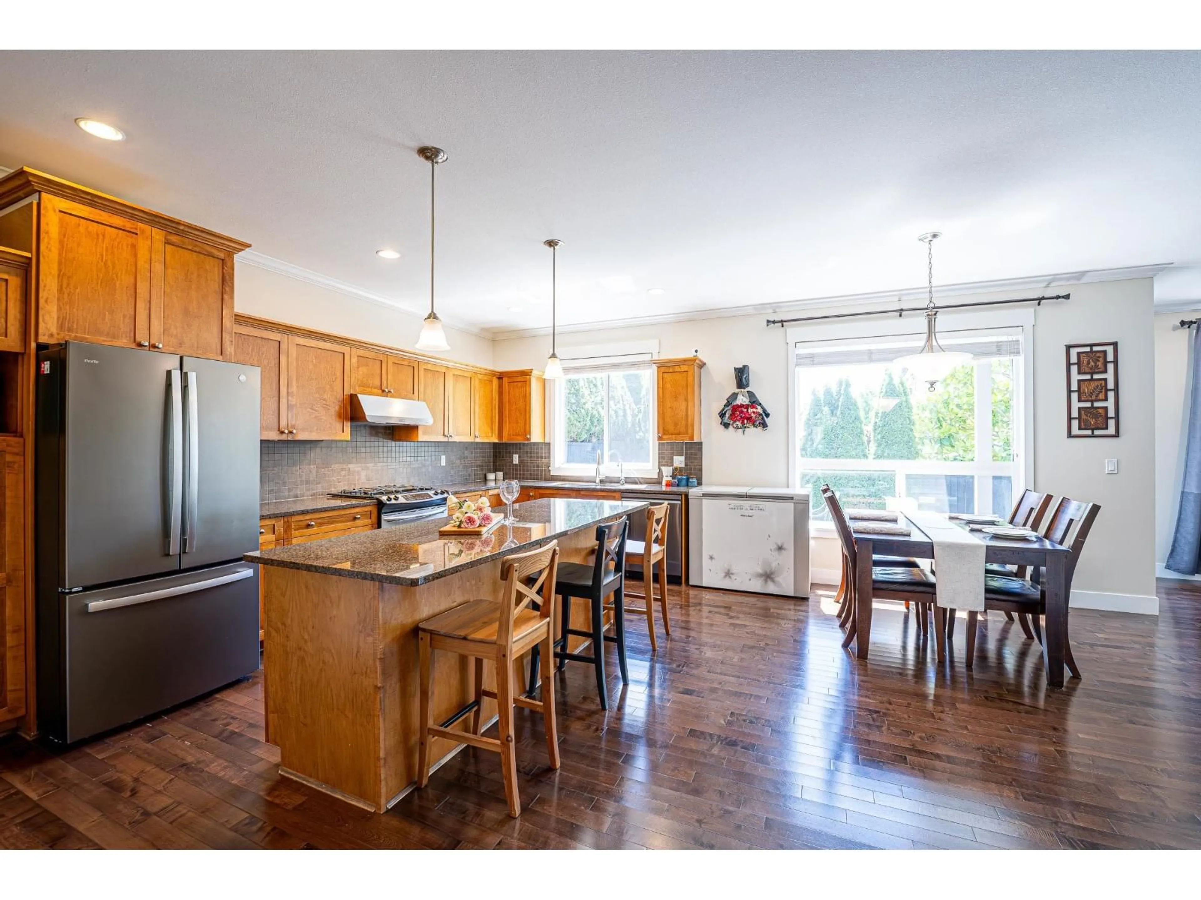 Open concept kitchen, wood/laminate floor for 17916 71 AVENUE, Surrey British Columbia V3S7C7