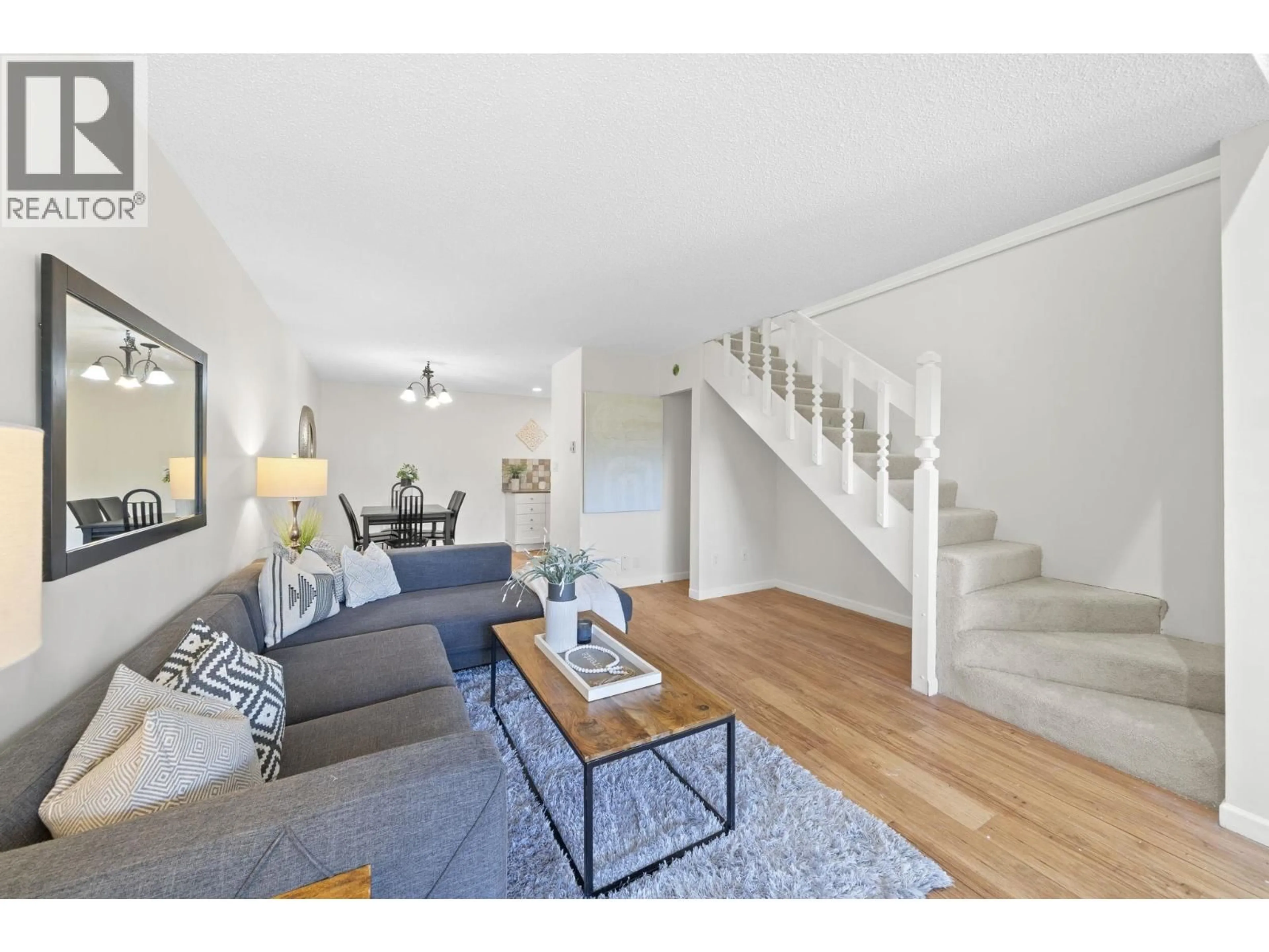 Living room with furniture, wood/laminate floor for 4896 47A AVENUE, Delta British Columbia V4K1T4