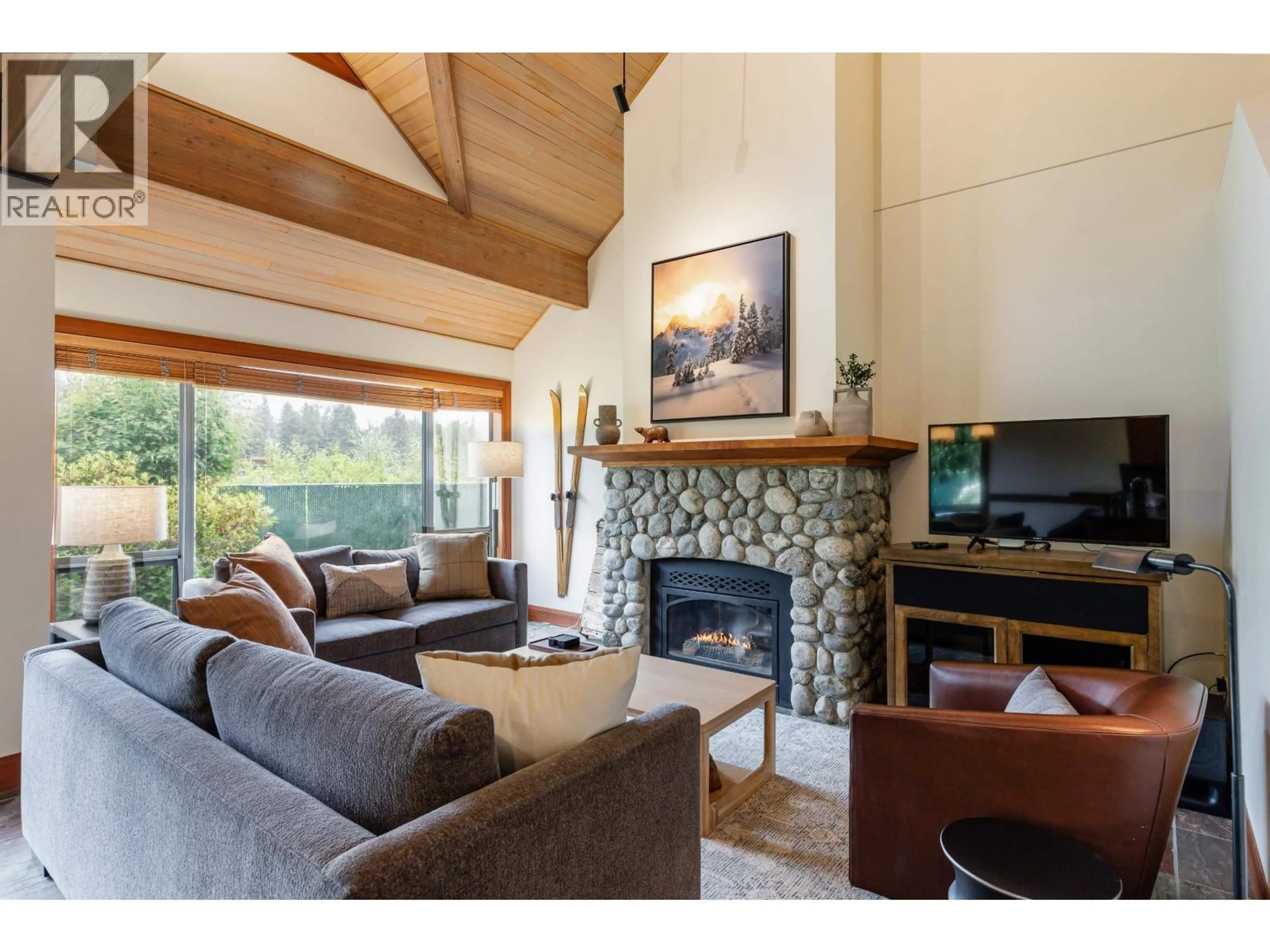 Living room with furniture, wood/laminate floor for 4728 A SETTEBELLO DRIVE, Whistler British Columbia V8E0Z4