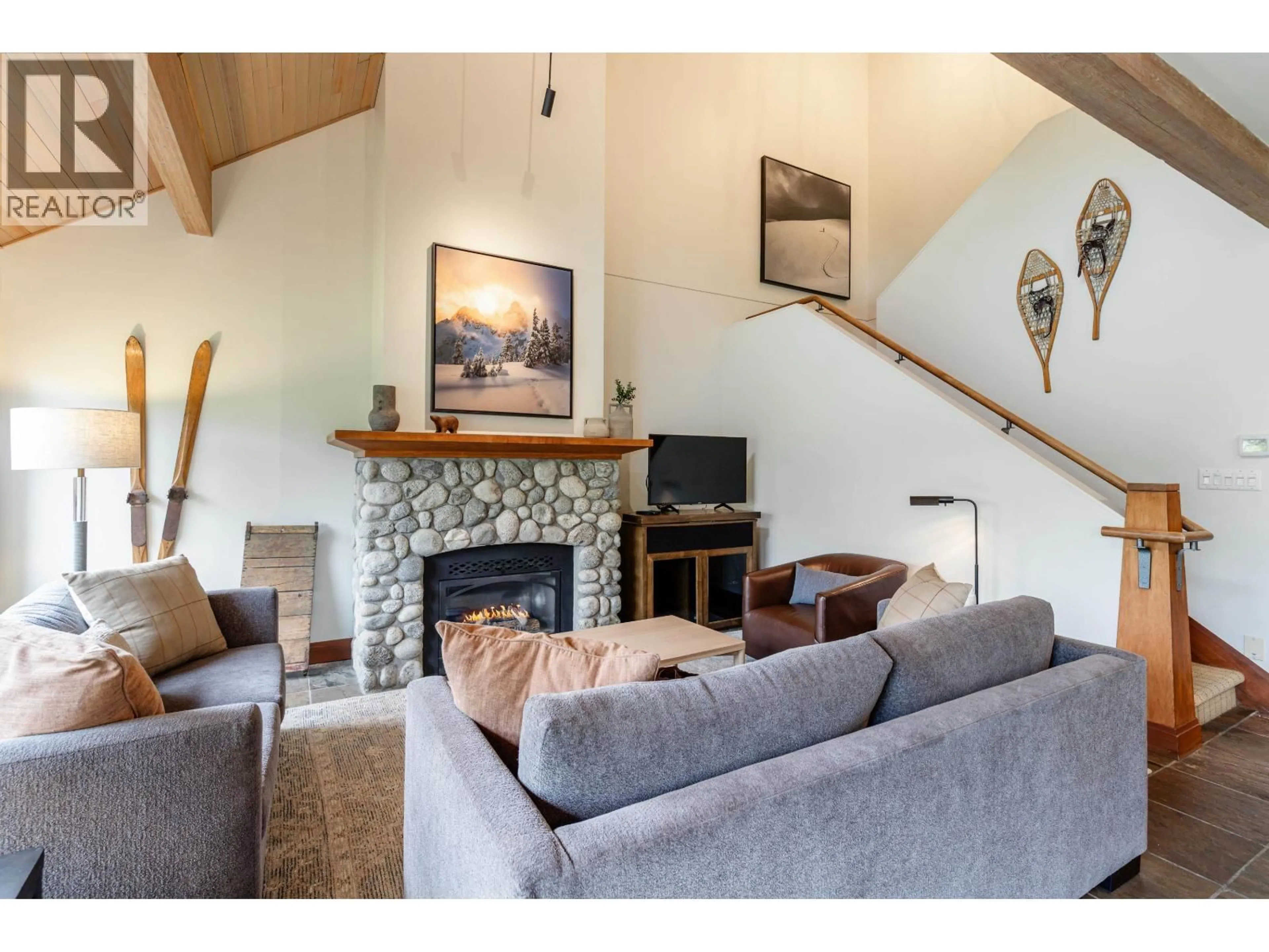 Living room with furniture, wood/laminate floor for 4728 A SETTEBELLO DRIVE, Whistler British Columbia V8E0Z4