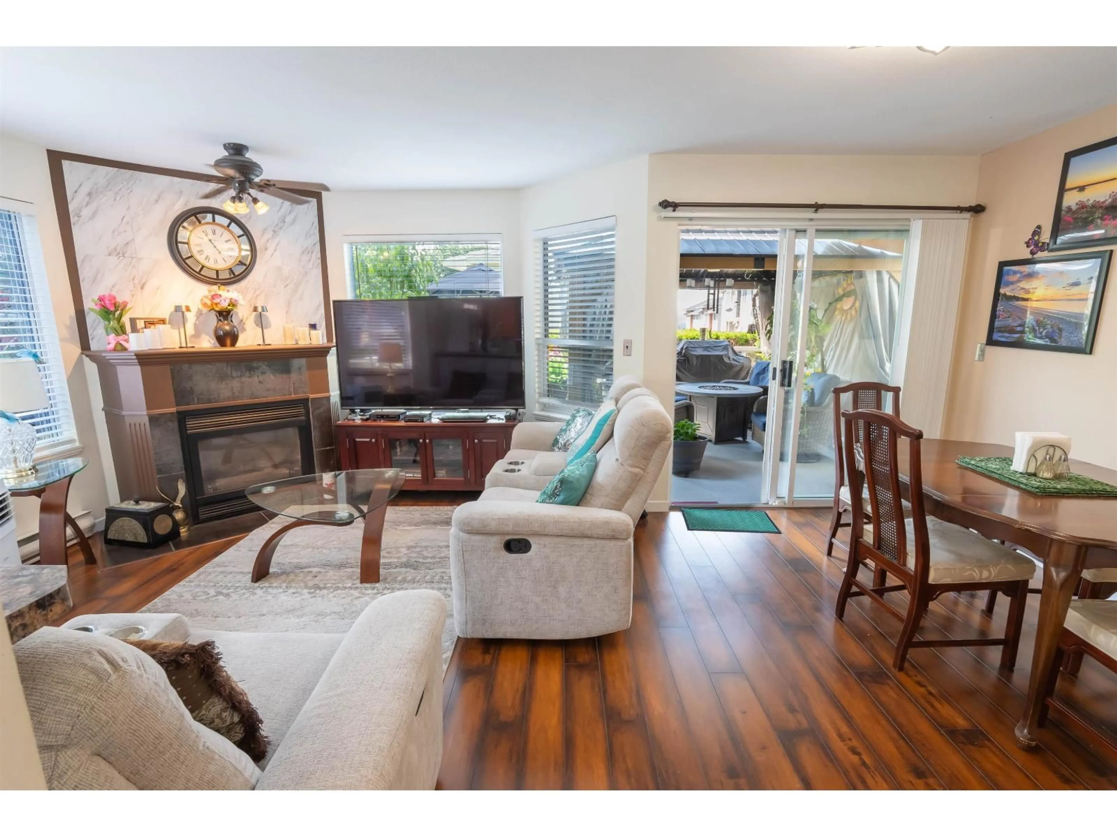 Living room with furniture, wood/laminate floor for 109 - 7554 BRISKHAM STREET, Mission British Columbia V2V3L9