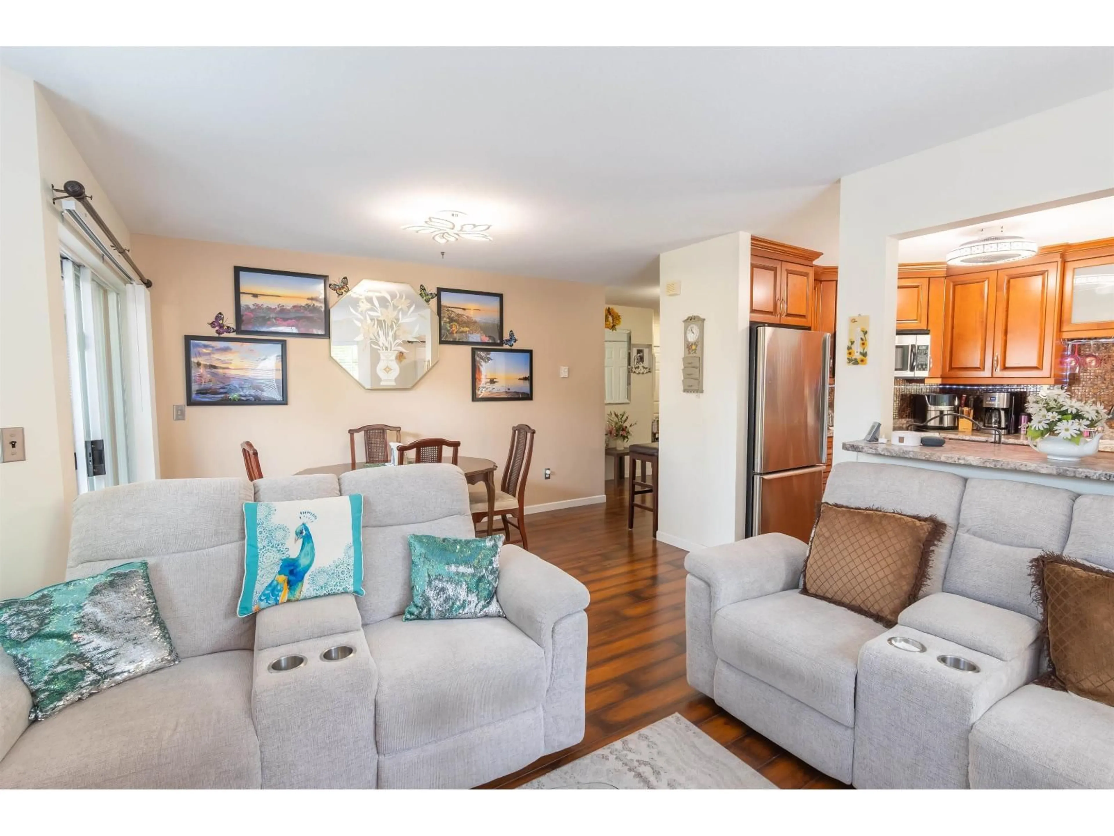 Living room with furniture, wood/laminate floor for 109 - 7554 BRISKHAM STREET, Mission British Columbia V2V3L9