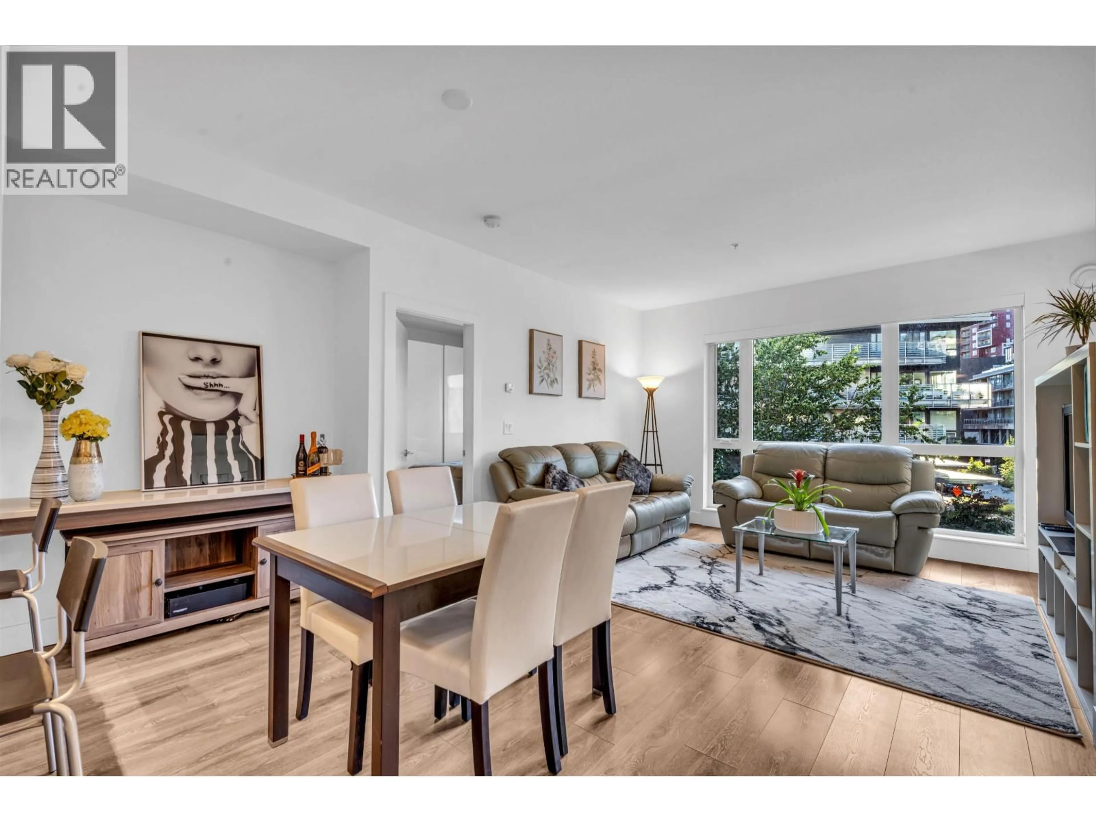 Living room with furniture, wood/laminate floor for 307 - 8580 RIVER DISTRICT CROSSING, Vancouver British Columbia V5S0B9