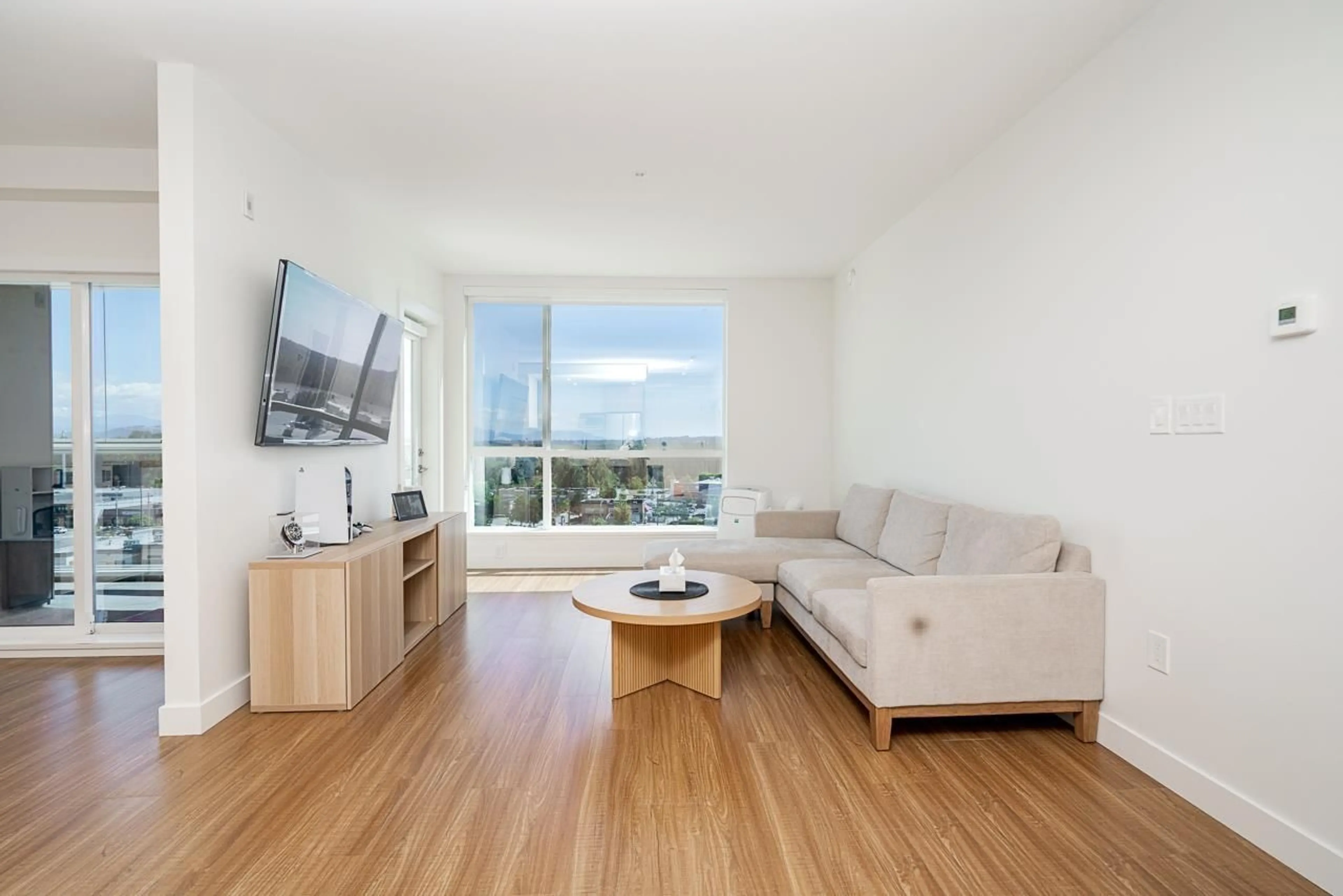 Living room with furniture, wood/laminate floor for 401 - 31940 RAVEN AVENUE, Mission British Columbia V2V0L1