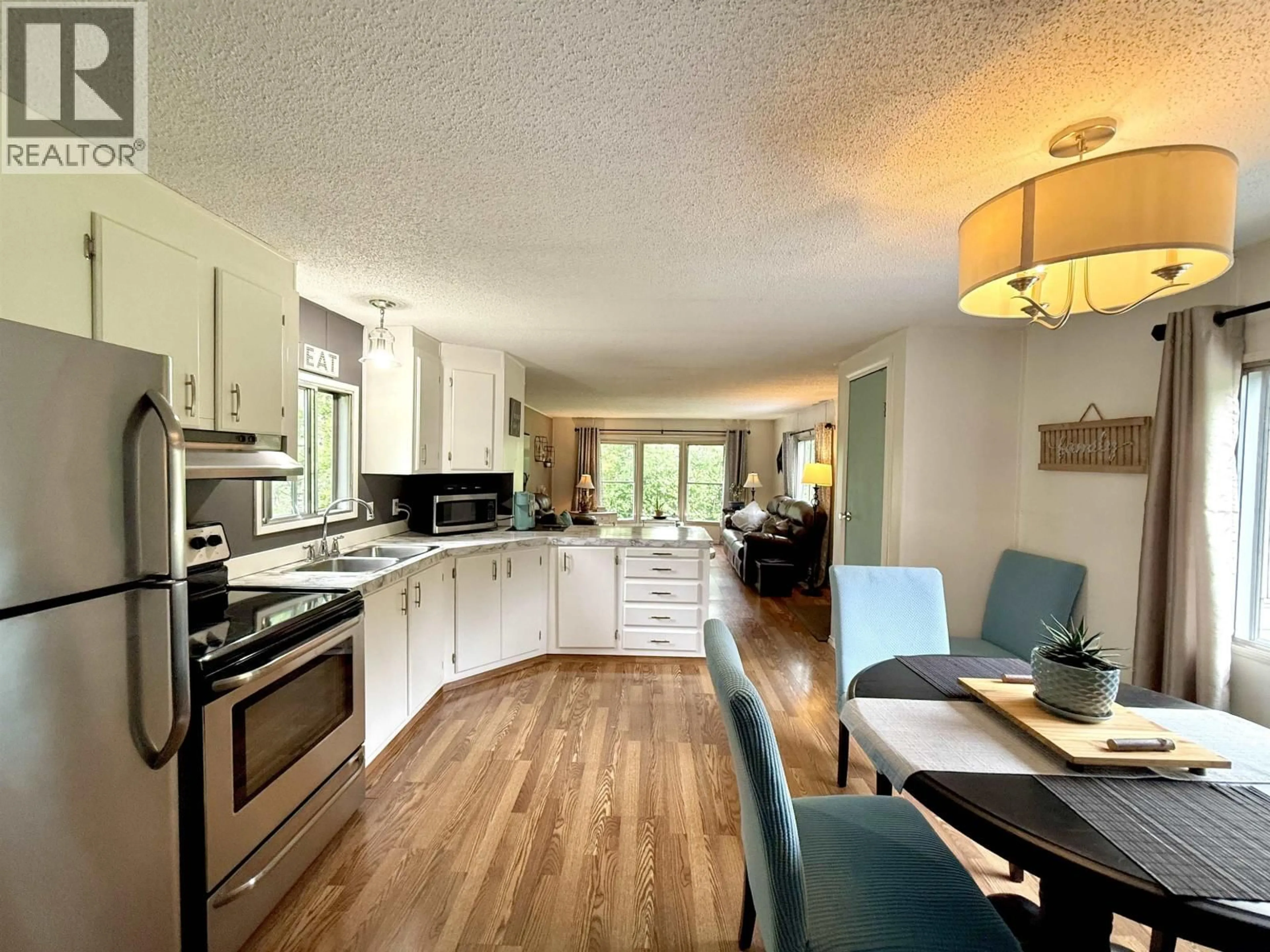 Open concept kitchen, wood/laminate floor for 2136 EVASKO ROAD, Prince George British Columbia V2N6T7