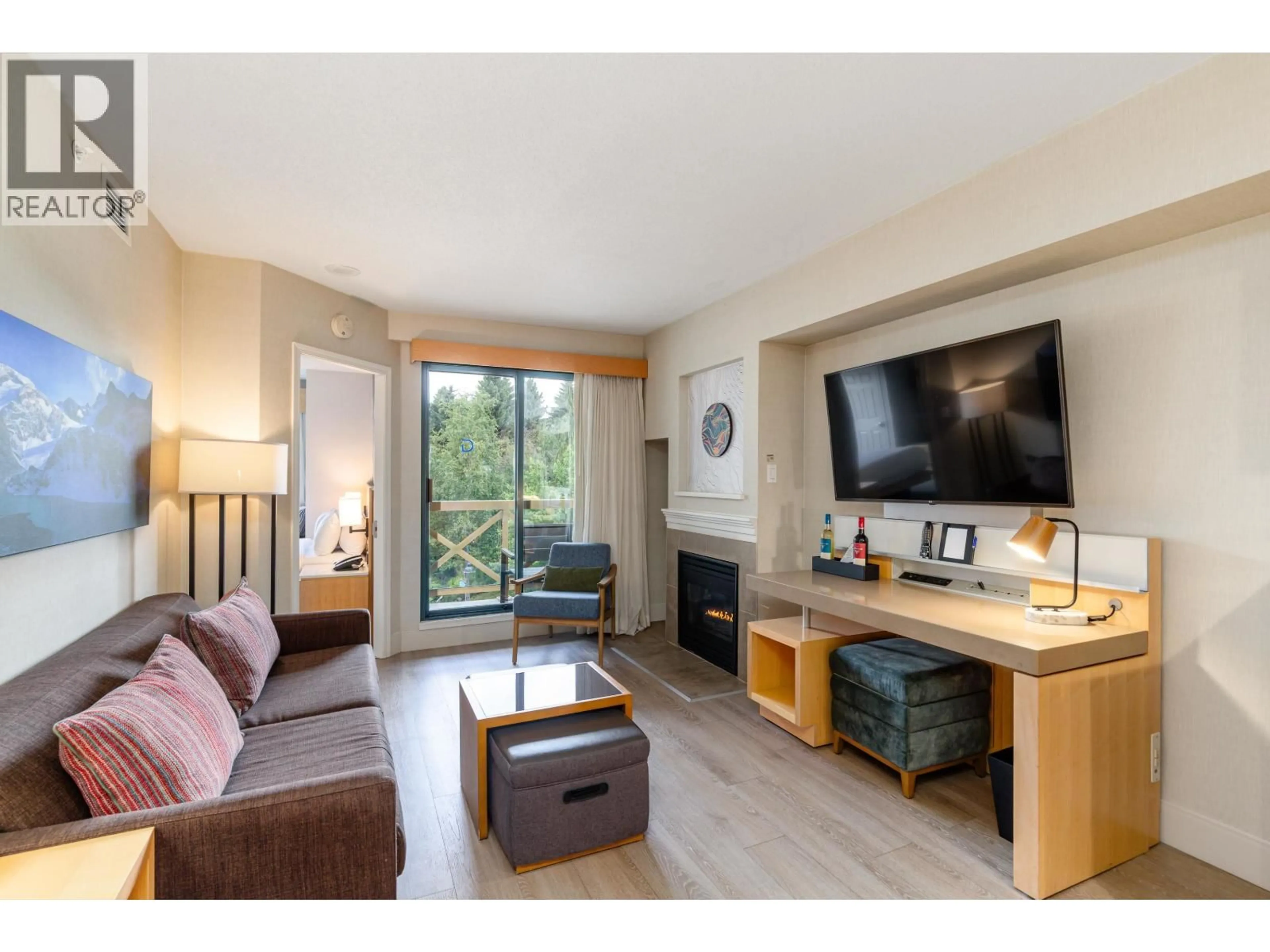 Living room with furniture, wood/laminate floor for 2318/20 - 4308 MAIN STREET, Whistler British Columbia V8E1A9