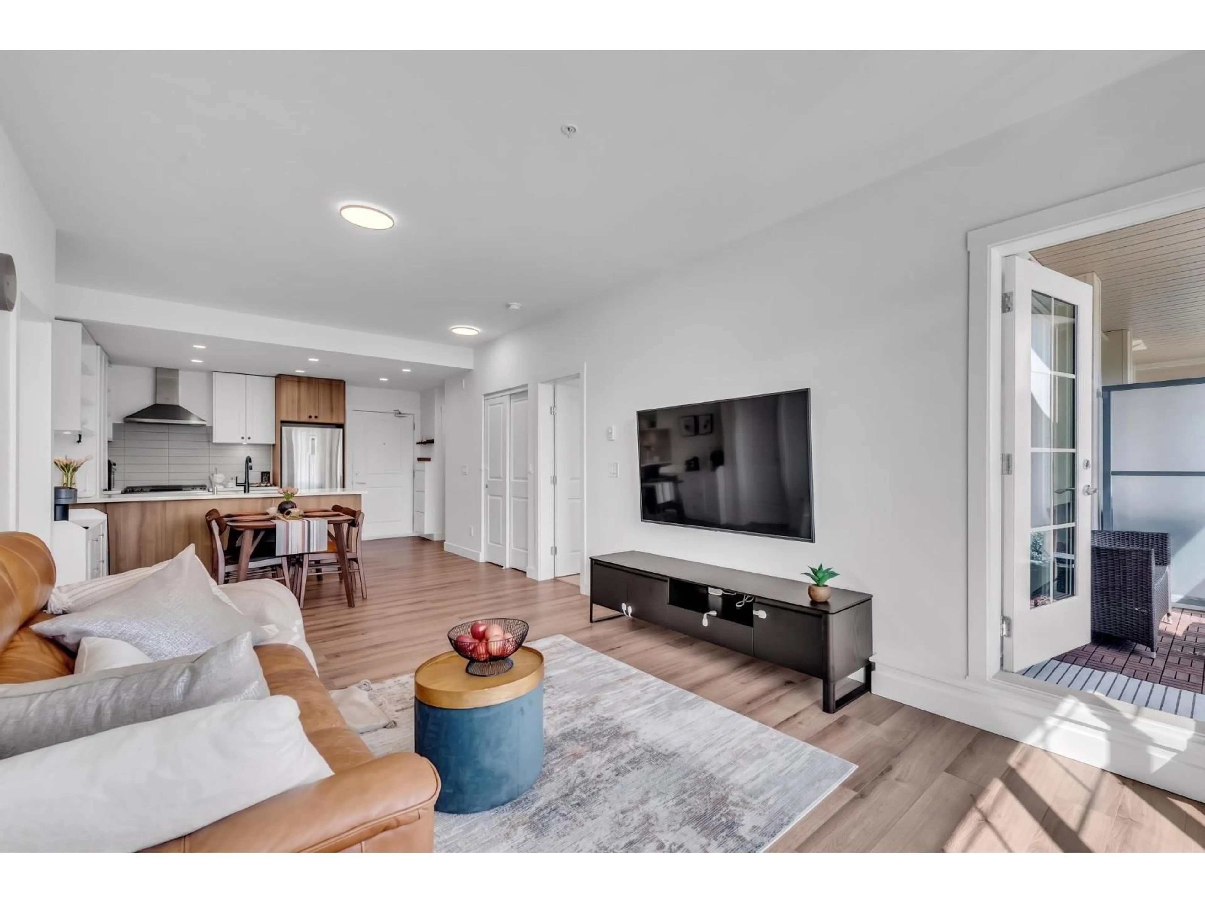 Living room with furniture, wood/laminate floor for B209 - 20487 65 AVENUE, Langley British Columbia V2Y3K6