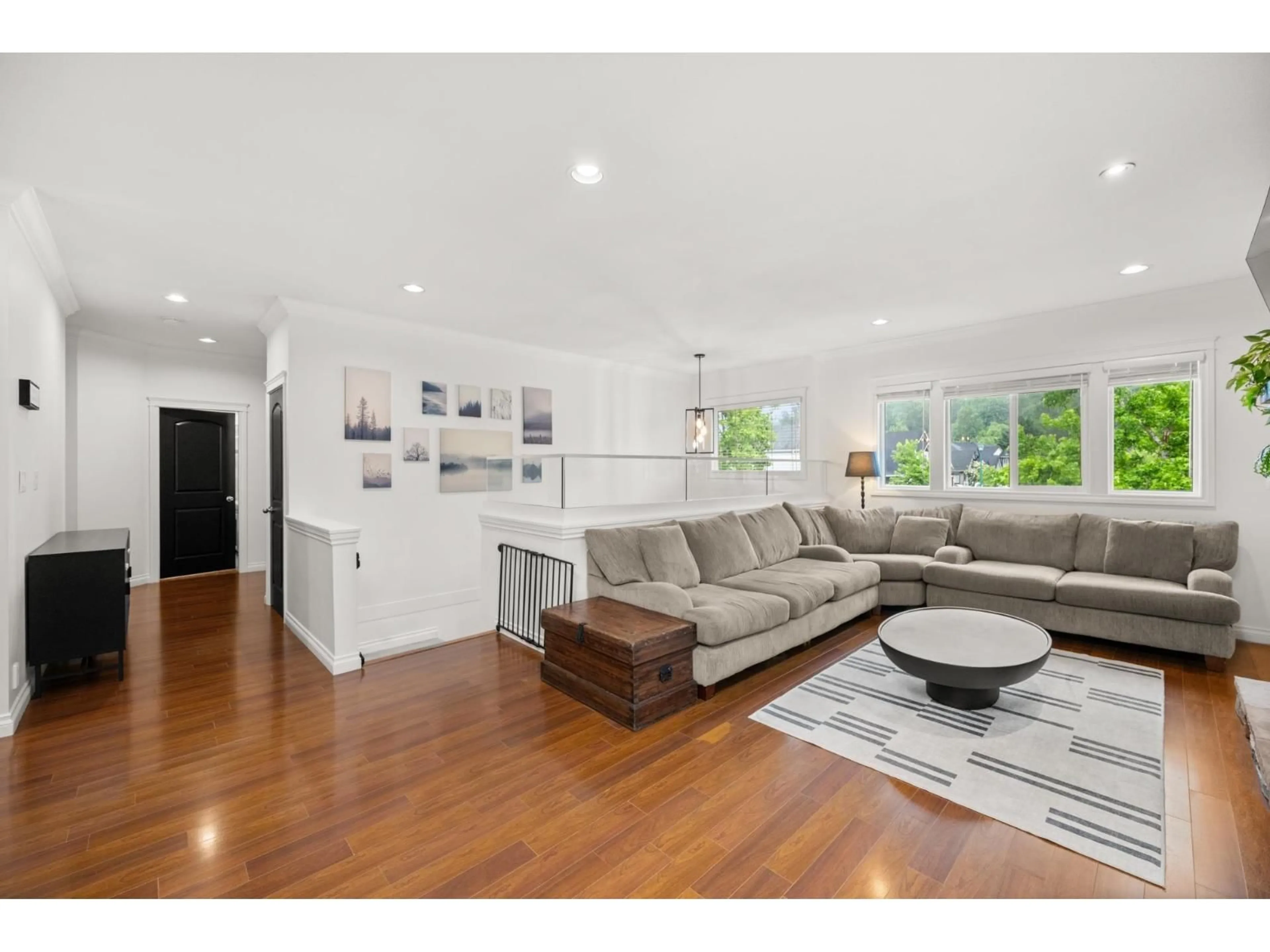 Living room with furniture, wood/laminate floor for 3887 ANGUS CRESCENT, Abbotsford British Columbia V3G0A2
