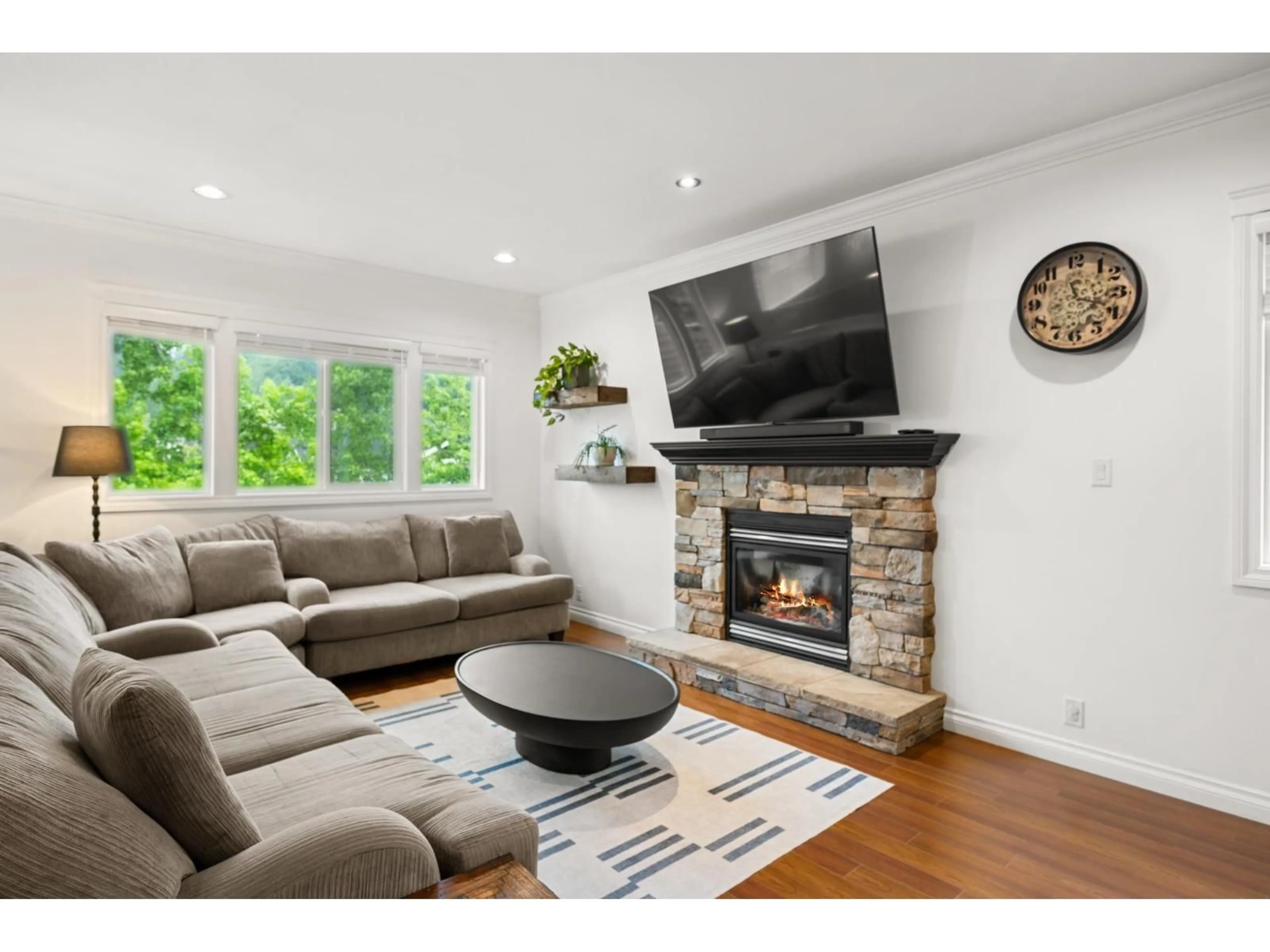 Living room with furniture, wood/laminate floor for 3887 ANGUS CRESCENT, Abbotsford British Columbia V3G0A2
